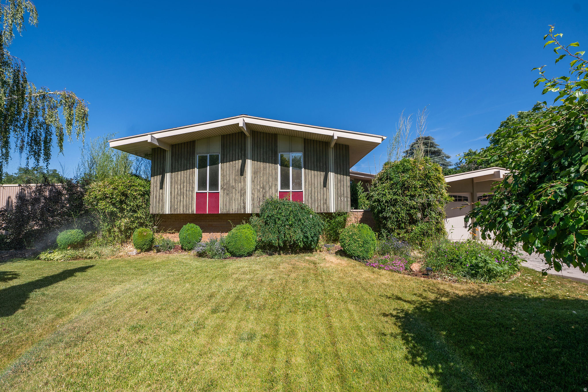 Tucked into a quiet West Valley City neighborhood with exceptional access to shopping, dining, parks, and commuter routes, this unique home offers peace of mind with major system upgrades already completed, including a new roof, furnace, plumbing, and wiring. Enjoy spacious living areas, mature landscaping, and a private outdoor patio/deck perfect for relaxing or entertaining. Retreat to your very own primary suite with ensuite bath and walk-in closet. A rare opportunity to own a character-filled home with big-ticket improvements already done. This home is just waiting for someone to create an ADU in the basement with its own living space and walkout. Perfect for anyone looking for a househack, investment, basement rental, or flexible living situation.