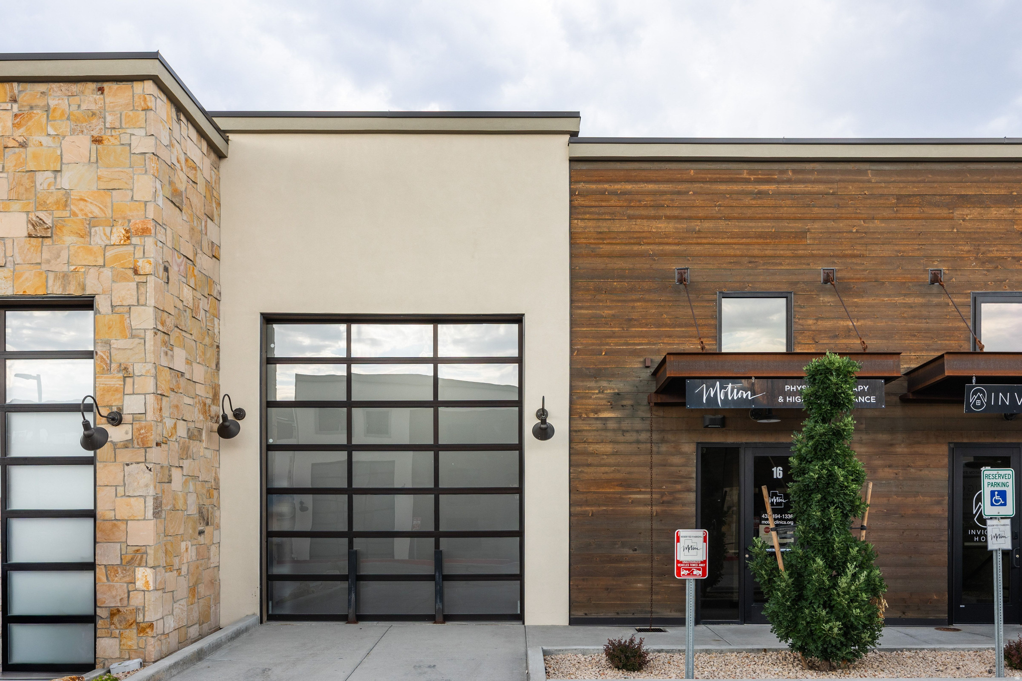 Rare opportunity to own one of Park East II's premier commercial condominiums in the heart of Park City. Ideal as an investment or future owner-user opportunity, the property is currently leased to a well-established local tenant with a proven five-year NNN lease history and renewal options, providing immediate income from day one. Offering 3,946 square feet across three levels, the property features 1,800 square feet on the main level with an oversized 14-foot garage door, restroom, and soaring 18-foot ceilings throughout most of the space. The lower level provides an additional 1,800 square feet with 9.6-foot ceilings, ideal for offices, a showroom, storage, or production space. The upper level includes a 350-square-foot private executive office or conference room and opens to a private rooftop deck with views of protected open space and Deer Valley's Bald Mountain. Designed for efficiency and flexibility, the building features no load-bearing interior walls, allowing the floor plan to be easily reconfigured for a wide variety of business uses while minimizing renovation costs. With more than 40 permitted uses, Park East II is home to a dynamic mix of law firms, architects, financial advisors, interior designers, builders, technology companies, and collectors of luxury automobiles, boats, and RVs. Whether you're seeking a quality income-producing investment or a premier flex space in one of Park City's fastest-growing commercial corridors, this property presents an exceptional opportunity.