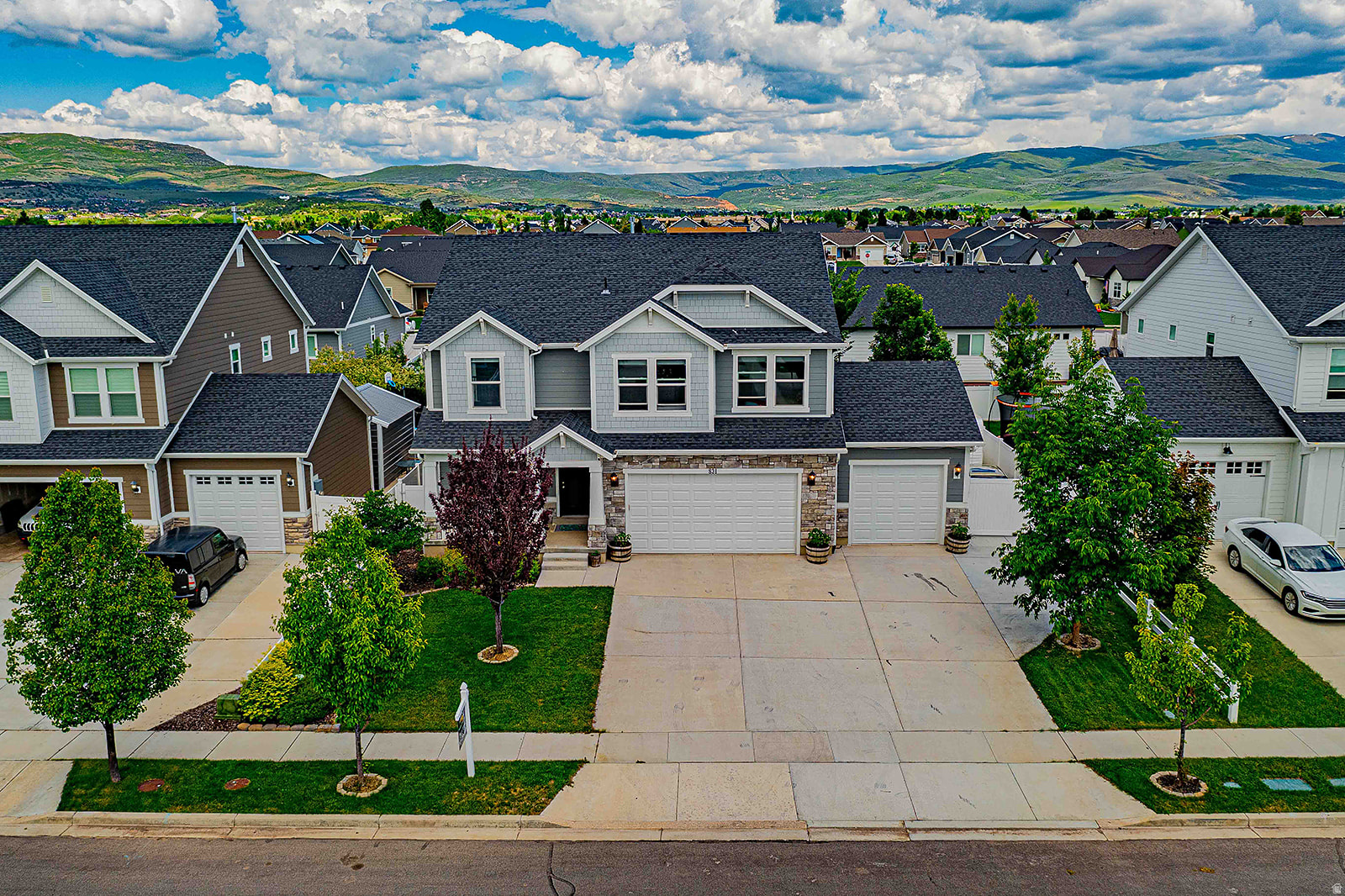FABULOUS single-family home in the heart of Heber City! Walking distance to Main Street, with nearby schools and nestled in a charming, highly desirable neighborhood. Bright, open floor plan featuring a stunning vaulted living room with a cozy fireplace, creating an inviting space to relax or entertain. The kitchen is beautifully designed with quartz countertops, subway tile backsplash, extra-tall cabinets with crown molding, walk-in pantry, stainless steel appliances, recessed lighting, and an oversized island with bar seating-perfect for gathering. The primary suite offers a peaceful retreat with French doors, vaulted ceilings, double-sink vanity, walk-in closet, and separate restroom. Upstairs includes three additional bedrooms and a convenient laundry room. The fully finished basement features a 3-bedroom, 1-bath setup complete with its own kitchen, laundry, and separate entrance, offering the option to offset your mortgage with rental income. Spacious three-car garage with ample parking, including room for an RV or trailer. Fully landscaped backyard with garden areas, a gazebo, morning sun and afternoon shade, and pre-wired for a hot tub, creating a serene and private outdoor living space.