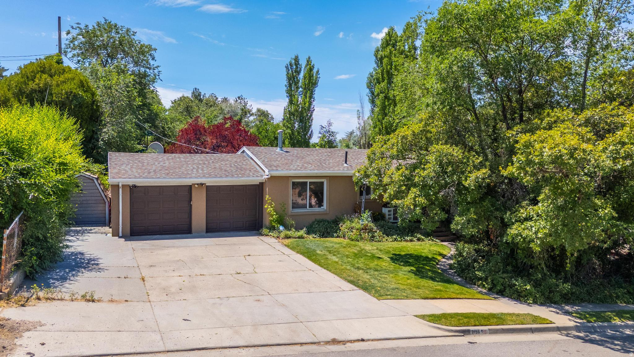 Some backyards are just grass and a fence. This backyard feels like its own zip code. Located directly across the street from Olympus Hills Park, this 4-bedroom, 2-bath Holladay home offers something that's becoming nearly impossible to find: real privacy. The backyard is surrounded by mature landscaping that creates a peaceful retreat where you can unwind, entertain, host summer BBQs, or simply disappear from the world for a few hours. The home features a 2-car garage, spacious living areas, and a separate basement entrance that opens the door for ADU potential, a mother-in-law apartment, rental income, or whatever setup works best for your situation. And when you're ready to leave your backyard paradise, Olympus Hills Park is literally across the street. Playgrounds, trails, open space, and one of Holladay's most sought-after locations are all right outside your front door. Homes can be updated. Landscaping can be changed. But you can't move a park across the street or instantly create a backyard like this. That's what makes this one special. ***OPEN HOUSE SATURDAY 6-27-26 FROM 10AM-12PM***