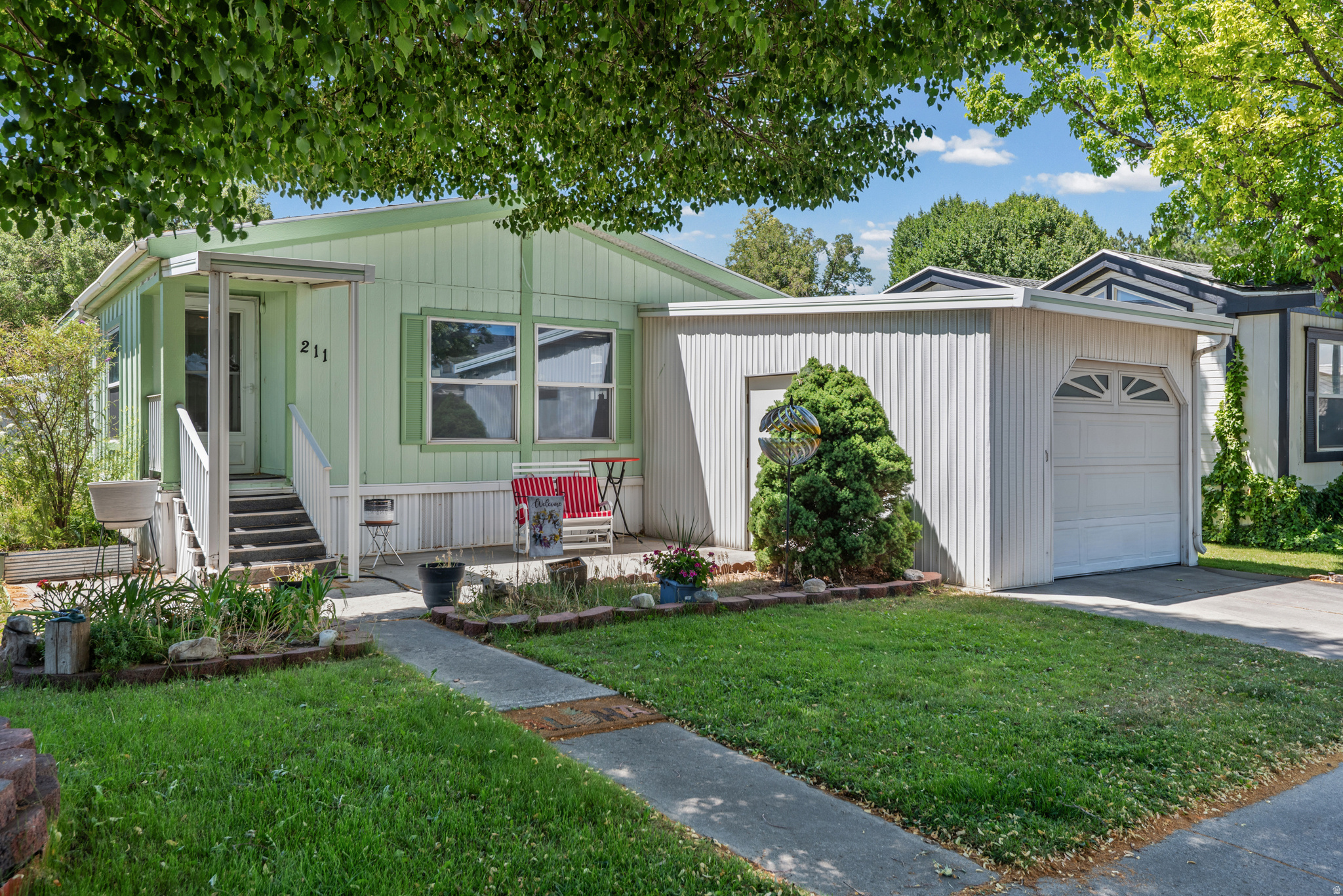 Affordable, spacious, and exceptionally well maintained! Welcome to the highly sought-after Seven C's 55+ Community, where pride of ownership and a welcoming neighborhood atmosphere make this a wonderful place to call home. This beautifully cared-for 2-bedroom, 2-bath home offers an open floor plan filled with natural light and comfortable living spaces. The upgraded kitchen features butcher block countertops, a large sink, abundant cabinetry, and generous counter space, creating a warm and functional heart of the home. The adjoining dining and living areas provide an open, inviting layout that's perfect for everyday living. One of the standout features of this home is the incredible amount of storage. In addition to the attached garage, a valuable feature not found in many homes at this price, you will also enjoy a large 10x12 storage shed and lots of interior storage throughout the home. A versatile bonus room offers endless possibilities as a home office, hobby room, craft room, reading nook, or additional sitting area. This could easily be a 3rd bedroom with the addition of a closet or armoire.  The spacious primary suite also includes a walk-in tub. With its excellent condition, garage, abundant storage, open layout, and affordability, this home is an outstanding opportunity for easy living in one of American Fork's most desirable communities.  Buyer to verify all!