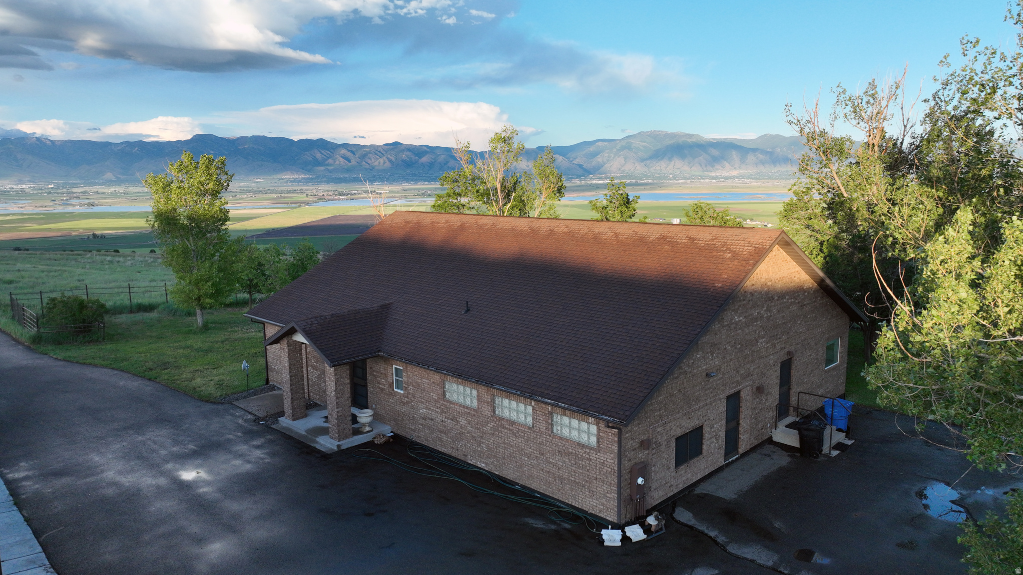 Private Cache Valley Horse Property with Unmatched Views This exceptional 75.41 acre horse property offers complete privacy and unobstructed views that can never be built out. Fully fenced with established trees and vegetation, the land attracts abundant wildlife and sits directly beneath a migratory bird flyway. Located just 15 minutes from Logan and I-15, it provides the perfect blend of seclusion and convenience. The ranch is fully set up for horses and livestock, featuring an automatic iron entry gate, asphalt driveway, round pen, and a large barn with high ceilings, hay storage, tack room, water, electricity, and easy paddock access. A four-bay garage accommodates large vehicles and equipment. The 2,151 sq ft home offers an open floor plan with vaulted ceilings, hardwood floors, a gas fireplace, and large windows showcasing stunning views of the Wellsville Mountains. A spacious patio with a fire pit is ideal for gatherings. The property also produces yearly income and benefits from greenbelt tax status. A rare opportunity to own a peaceful, scenic, and turn-key horse property in Cache Valley.