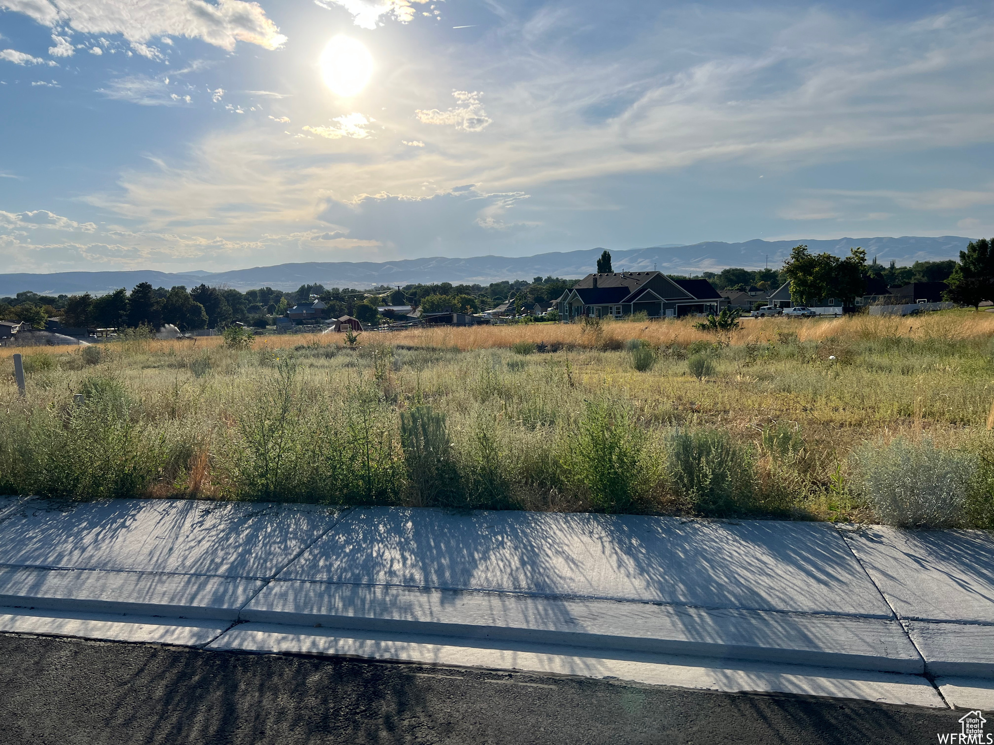 This .41 acre lot in the new Jamestowne subdivision is just waiting for your home building plans. Gorgeous mountain views to the north and east are complimented by a spacious vista across the valley to the west. The slightly sloping lot allows for a walkout basement, if you desire. The irrigation easement on the west side of the property is underground. Curb, gutters and street are complete, and utilities are stubbed to the lot.