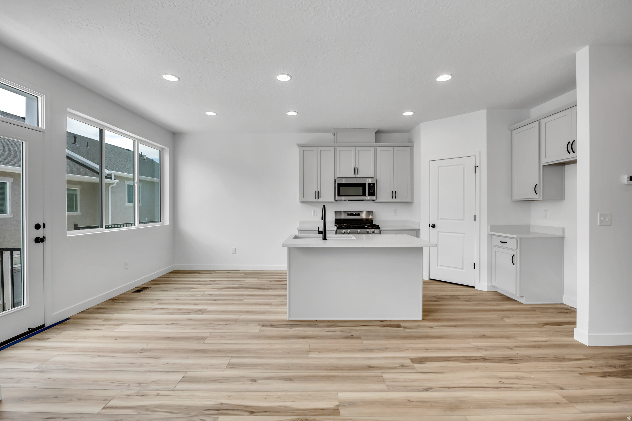 This is our Yale floorplan, located in our Sky Ranch Community in West Jordan. This home features 3 bedrooms, 2.5 baths, loft space, laundry room, 2 car garage, walk out basement into yard area, modern finishes including black metal railing, and a deck off of the kitchen. Our community features a pool (with lazy river!!), park, & two pickleball courts. This home is ready for its new owner at the end of July. Come check out this amazing home in this fun neighborhood!