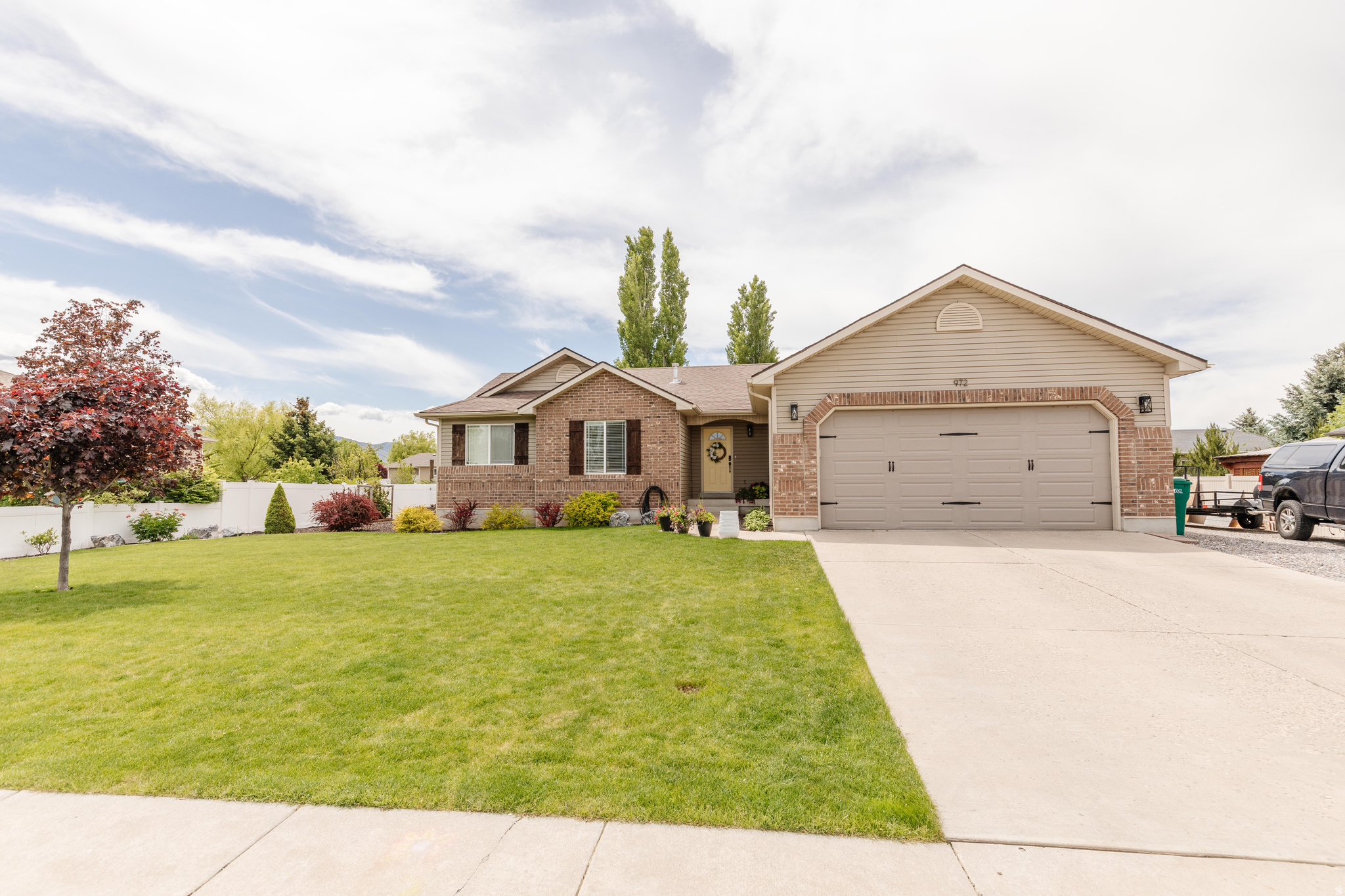 Welcome to this beautifully maintained 5-bedroom, 3-bath home in the heart of Nibley! Thoughtfully updated and meticulously cared for, this home is truly move-in ready. Recent upgrades include new paint and updated flooring throughout, stylish light fixtures, a stunning fireplace and mantle, and a gorgeous new stair railing that adds warmth and character to the space.    The functional layout offers two laundry hook-ups, abundant storage throughout, plenty of room for comfortable living and entertaining.  Outside, you'll love the beautifully landscaped yard featuring new curbing and an entirely new sprinkler system.  RV parking provides extra convenience, and the backyardhas conduit installed for a hot tub.   This home reflects pride of ownership inside and out - a rare find with thoughtful updates, exceptional care, and all the extras buyers are looking for!