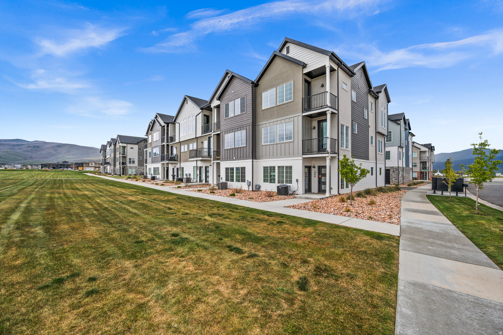 MUST SEE FOR YOURSELF- Wake up to Wasatch Views! This stunning end row new construction townhome in Heber City's sought-after Sawmill community delivers the mountain lifestyle you've been waiting for - and with an included ADU... the financial flexibility to make it work. Spread across three thoughtfully designed levels, the main home features 3 bedrooms and 3.5 bathrooms, wide plank floors, soaring 9-foot ceilings, and a chef's kitchen with quartz island, sage shaker cabinets, Bosch stainless appliances and a gas range - all framed by oversized windows with panoramic mountain views. Enjoy the open concept as the kitchen flows seamlessly into the living room and an additional flex space ready to suit your needs! Upstairs the primary suite features its own balcony deck and a spa-inspired ensuite and a huge walk-in-closet. Two more bedrooms with included ensuite bathrooms, a laundry room and huge storage/linen closet cap off the 3rd floor. On the first floor, the attached private ADU studio with its own entrance, kitchen, bathroom offers an opportunity to offset your mortgage each month OR works as the perfect home office/ business space. Pick your colors and finishes to customize your mountain haven! Resort-style HOA amenities include a pool, gym, pickleball courts and clubhouse (coming soon). Ask about our builder and lender incentives for a great interest rate including a 2/1 buydown option and make these mountain dreams a reality!
