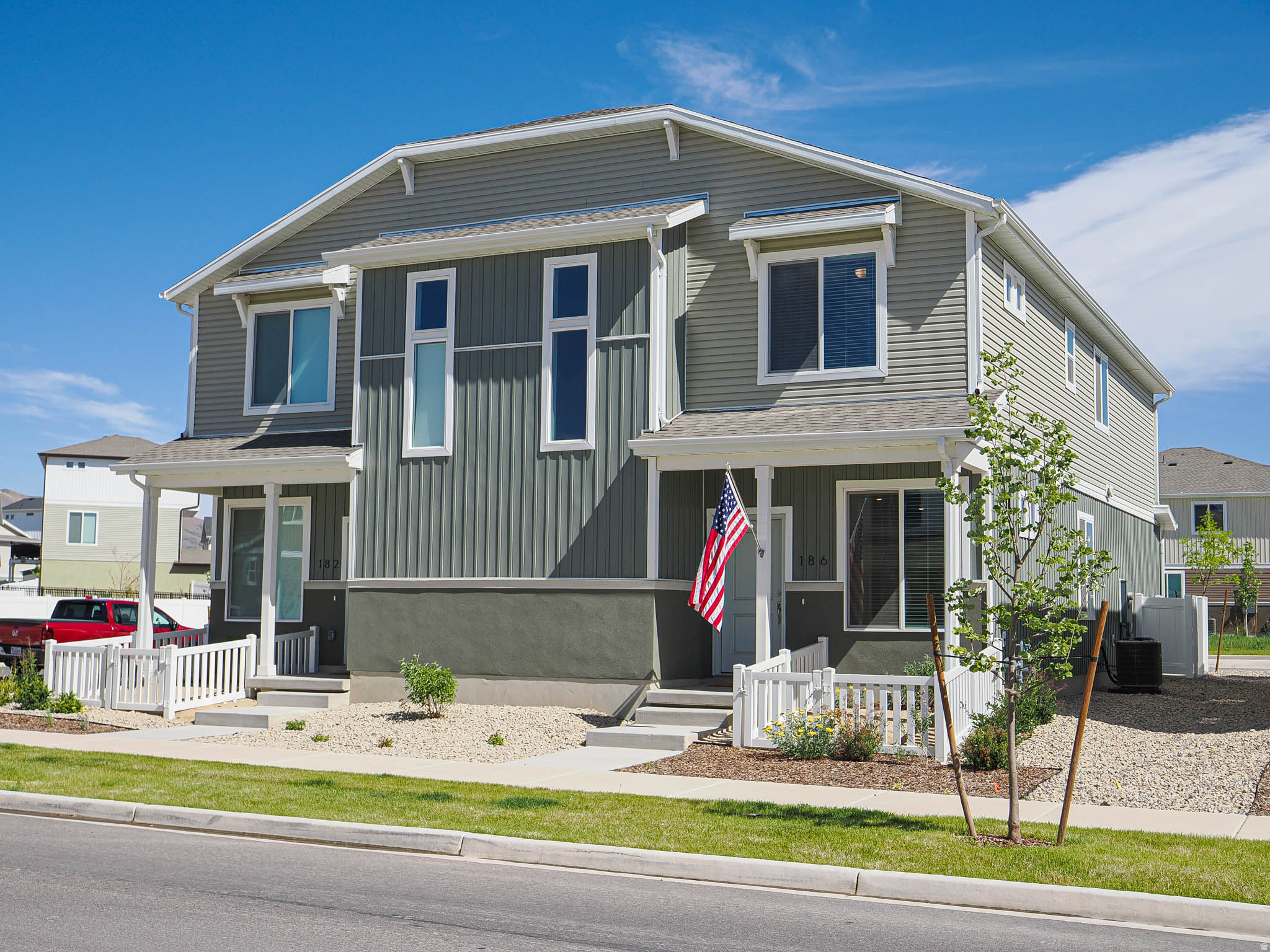 DON'T WAIT FOR A BUILD - Buy MOVE IN READY NEW!  Rates starting at 4.375% APR w/preferred lender! Live in this amenity-rich community along Utah Lake's north shore with parks, trails, and recreation nearby. This charming 2-story duet-style home features 4 bedrooms, 2.5 bathrooms, and 1,587 square feet of thoughtfully designed living space, plus a 2-car insulated garage with a private driveway. Enjoy the feel of a single-family home with only one shared wall and easy, low-maintenance living. Enjoy a bright open-concept layout with oversized windows, a spacious great room, and a beautiful kitchen featuring a dining island, stylish quartz countertops, stainless-steel sink, large pantry and custom made breakfast nook. The private primary suite includes a spa-style shower and large walk-in closet. Complete with charming curb appeal, front landscaping, and a classic white picket fence - this home is the perfect blend of comfort and style!