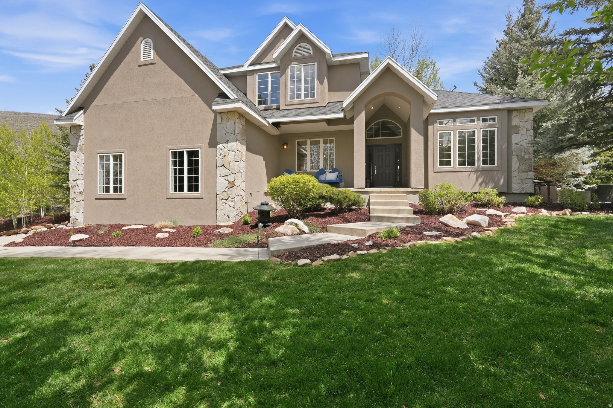 Tucked within the quiet, tree-lined streets of Jeremy Ranch, this inviting mountain home blends comfort, privacy, and everyday livability. Set on a private lot with a flat usable yard, the property feels like a hidden retreat--where mornings begin with coffee on one of two secluded patios and evenings are spent surrounded by fresh mountain air and the calm of nature. Inside, warm and welcoming spaces are designed for both gathering and quiet moments. The main level flows seamlessly between the spacious great room and kitchen, creating an ideal setting for entertaining or everyday living. A dedicated office offers a peaceful work-from-home space, while the formal dining room adds a touch of elegance for hosting family and friends. Upstairs, the home features four bedrooms and two full baths, including an expansive primary suite that serves as a true private retreat. Filled with natural light, the suite offers generous space to unwind along with a full bath that creates a comfortable sanctuary separate from the rest of the home. The additional bedrooms provide flexibility for family, guests, or additional workspace. The lower level adds even more versatility with a spacious family room and a substantial unfinished area already plumbed for a future bathroom and full build-out. Whether envisioned as a guest suite, fitness area, theater room, or recreation space, the opportunity is already in place to customize the home for years to come. Beyond the home itself, Jeremy Ranch is known for its mature trees, larger homesites, championship golf course, and easy access to both Park City and Salt Lake City. Residents enjoy miles of trails, abundant wildlife, and quick access to world-class skiing, dining, and outdoor recreation--making it one of Park City's most beloved year-round neighborhoods.