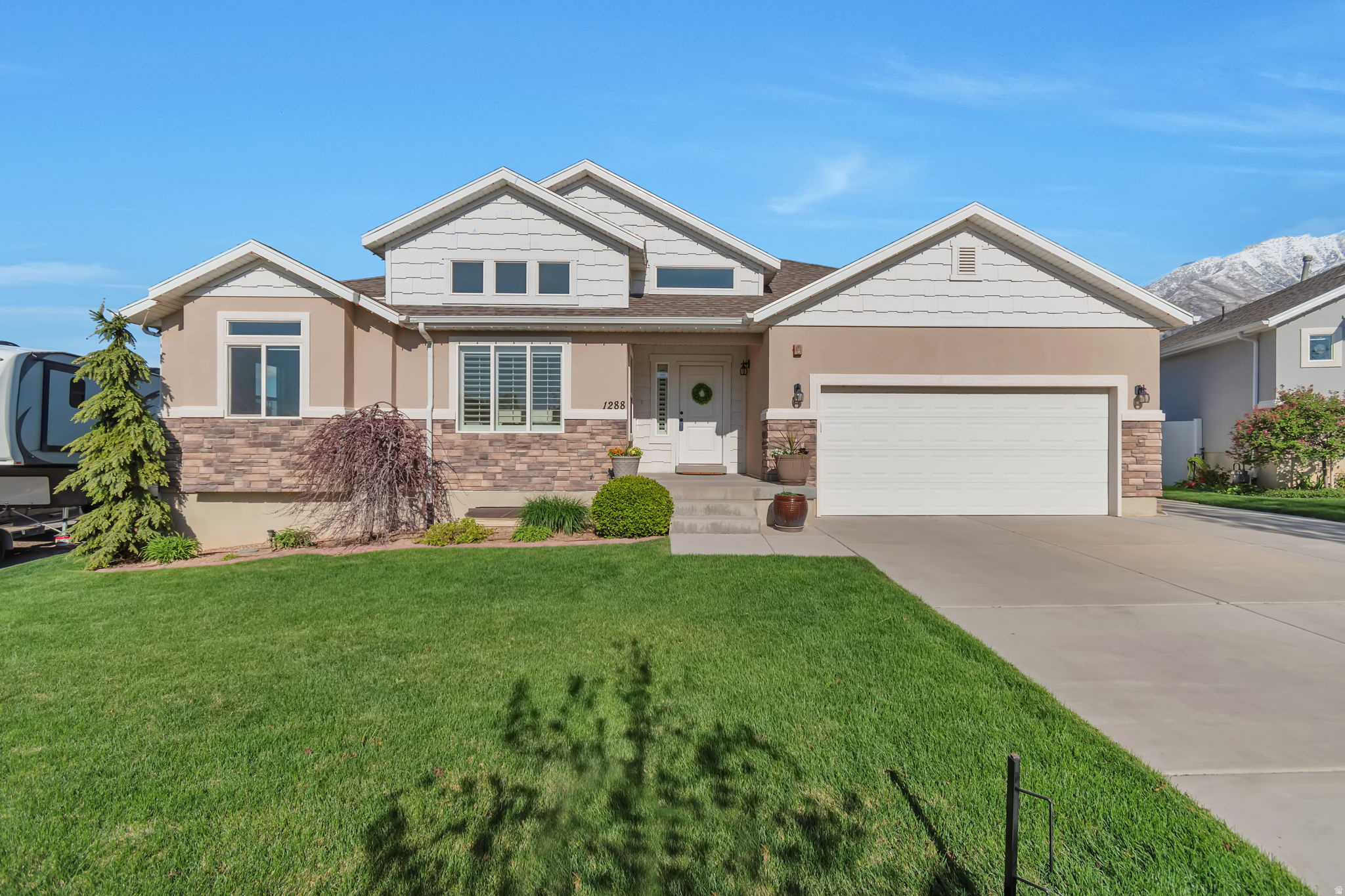 New Price Drop!  Move-in ready 5 BED / 3.5 BATH home with unobstructed views of Mount Loafer and no rear neighbors. Built less than 10 years ago, this one-owner property has been well maintained! Main level features 3 bedrooms and 2.5 bathrooms, including a master suite with walk-in closet as well as a spacious Office.  Open kitchen and living area with large windows showcasing mountain views. Basement is fully finished with 2 bedrooms, 1 bathroom, a large Family/Rec room, generous windows, and recessed lighting, as well as KITCHENETTE, with the potential to convert into a MOTHER IN LAW apartment! Backyard includes white vinyl fencing, automatic sprinklers, raspberry patches, and direct gate access to city parkland with trails, park, and disc golf. Extras include a 2-car garage with , water softener, all appliances, and window coverings. Updated Water Heater. Quiet street, 10 minutes from I-15, close to schools and shopping, and less than a mile from Gladstan Golf Course.