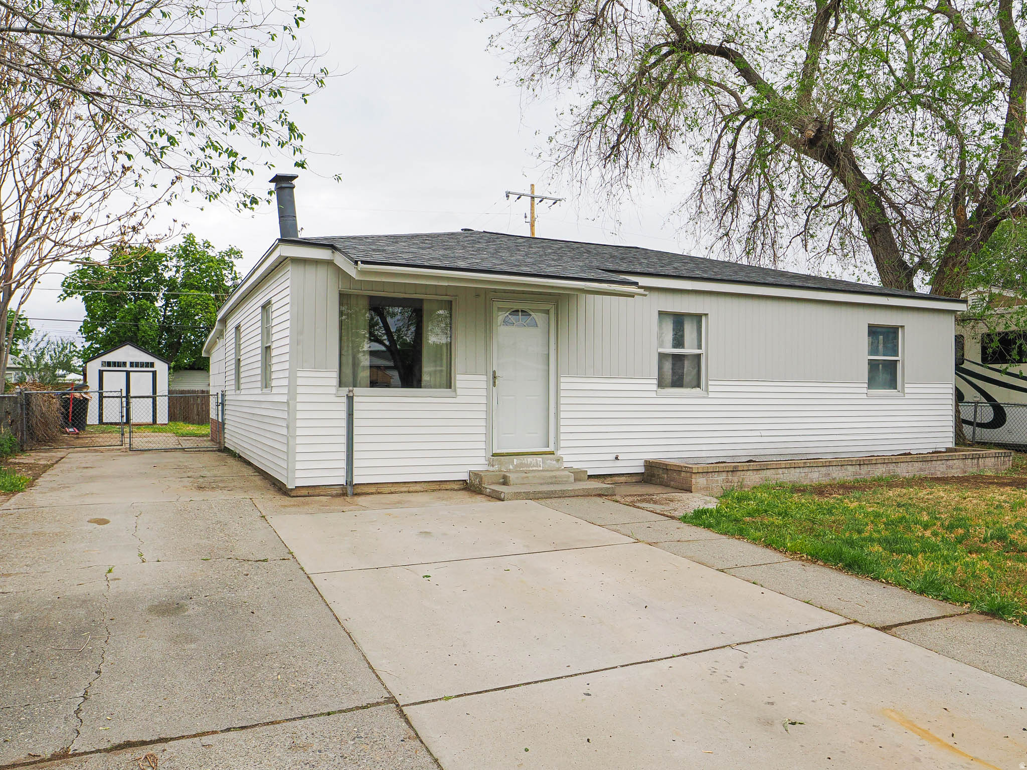 Fresh, clean, and ready for you! This single level move-in-ready home has been thoroughly updated for the next owner. The interior and exterior feature fresh paint, new flooring, new kitchen cabinets, quartz countertops, a gas stove, a pantry, mudroom and is open and bright! The primary bedroom is extra large and includes a walk in closet. Fenced yard, RV parking and with a transferable roof warranty, newer HVAC, and updated plumbing, you can spend your weekends enjoying the fenced backyard rather than worrying about maintenance. Rent to own option available with preferred lender.