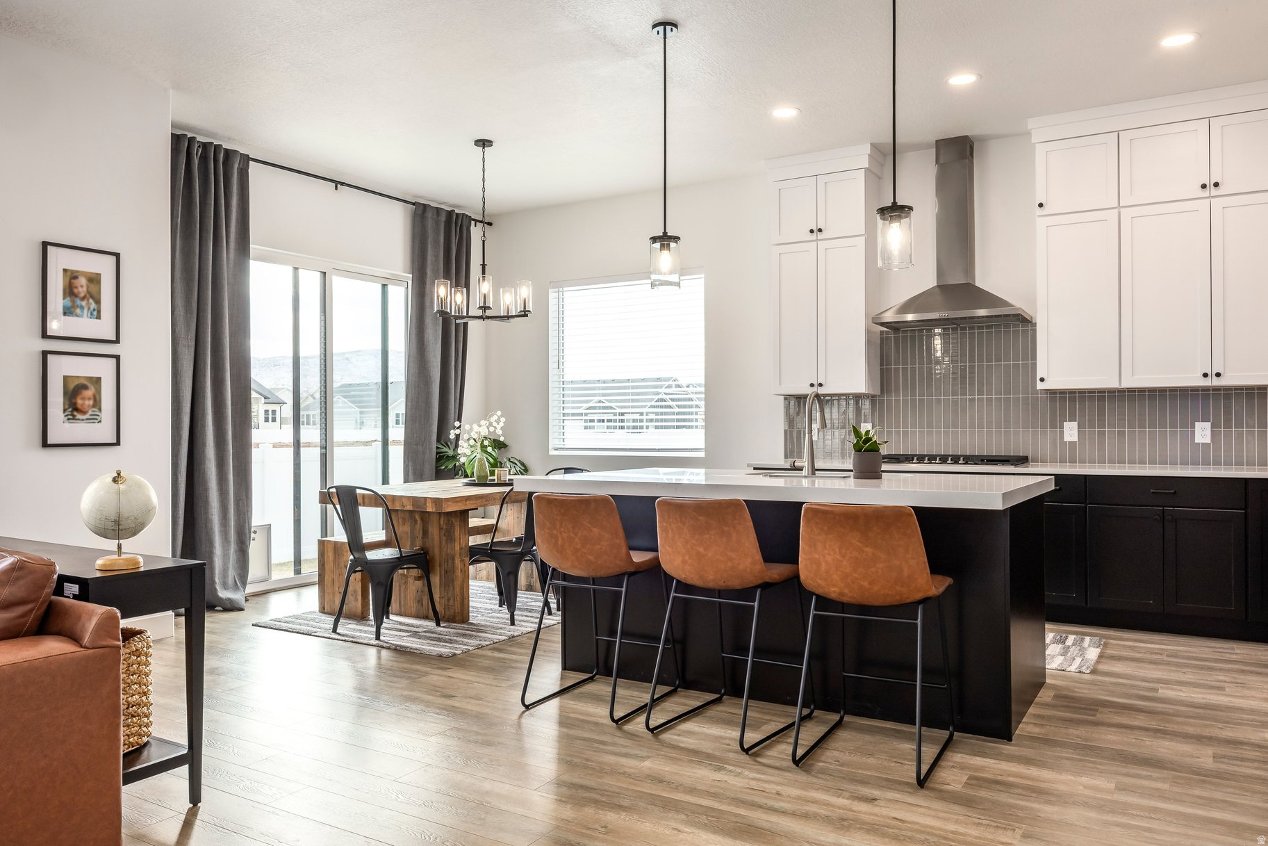 Better than new-this nearly brand-new home delivers modern luxury, open-space privacy, and exceptional flexibility without the wait. Less than 18 months old and completely turn-key, this thoughtfully designed residence offers primary-floor living, soaring vaulted ceilings, and a bright, open layout that lives beautifully for both full-time owners and investors-all just 15 minutes from both Deer Valley Resort and Sundance Resort. With 5 bedrooms, 3 bathrooms, and a spacious 3-car garage, the home provides ample space for family, guests, or rental income potential. Positioned to capture the benefits of open space and lower-density surroundings, the setting offers a rare sense of privacy and breathing room while maintaining easy access to world-class recreation, dining, and year-round amenities. Designed for today's lifestyle, this property is nightly-rental approved with a minimum one-night stay, making it an exceptional opportunity for short-term rental income, second-home ownership, or a flexible primary residence. Every detail is complete and move-in ready-no construction delays, no upgrades needed, just immediate enjoyment or income. Whether you're seeking single-level convenience, a lock-and-leave investment, or a like-new home in a low-density open-space setting near Utah's premier mountain resorts, this property stands out as a rare opportunity to own new construction quality without the wait. Photographs included in the listing contain virtually staging of furniture and other decor and are intended for illustrative purposes only