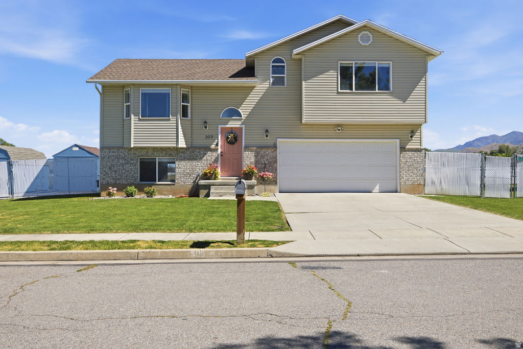 Updated home in a prime location close to schools, shopping, and bus routes. It features spacious storage, a large garage, and RV or additional parking on the side of the home.  The home also comes complete with  a hot tub pad and the wiring already done.  The walkout basement leads to a very private backyard with no neighbors behind it!  The backyard is fenced and has a sprinkler system for easy summer time watering.  Come see all the nice details and quality upgrades this home offers.  Buyer to verify all information.