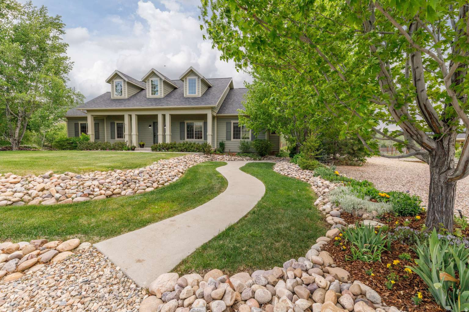 Custom home with new roof, carpet, fresh interior/exterior paint, refinished kitchen cabinets, new quartz countertops and appliances. This turnkey ready 5325 sq home resides in beautiful, private neighborhood on 1.57 acres. A total of 7 bedrooms & 5-1/2 baths including 397 sf bonus-room with full bath over 3-car garage. Large master bedroom with jetted tub and sitting room. The main floor laundry/pantry room boasts multiple countertops, cabinets and shelves. The basement includes two storage rooms and a laundry. Property includes new 1012 sf detached workshop, producing fruit orchard of peaches, pears, cherries, plums and apples, large fenced in garden, chicken coop, firepit and pasture. Large front and backyard lawn, mature trees and extensive landscaping with room to run. Under 30 minutes to world class skiing, mountain biking and hiking at Pineview Reservoir, Snow Basin, Nordic Valley and Powder Mountain. Enjoy the outdoors and privacy with nearby amenities in this unique home.