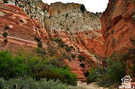 Incredible Lot! Red Valley Heights Phase 1 with .46 acres overlooking highway 89, and Orderville valley with magnificent white cliffs as a backdrop. Sitting at the base of Red Hollow Slot Canyon trail. Enjoy the old original Main Street US-89, rich Utah history, best temperatures in the state, small town living at its finest with utilities brought to the front of each lot. 18 acres open space behind the lot. CC&R's but no HOA, best of all worlds. Red Valley Heights is just minutes away from Zion National Park, Bryce Canyon, Kanab, and 1 hr and a half from Lake Powell. These lots are going fast! Square footage figures are provided as a courtesy estimate only and were obtained from surveyor report. Buyer is advised to obtain an independent measurement.