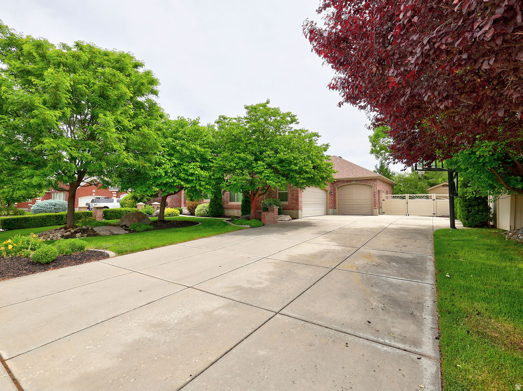 This incredible all brick home is located on a cul-de-sac in the Prestigious Autumn Farm neighborhood.  Homes rarely come available in this neighborhood and when they do they sell quickly! The home has a great floor plan with 2 kitchens and an apartment with access through the spacious 4 car garage. New roof 2022, new furnace 2023, AC 2025, Water heaters, 2025,2017, new interior paint 2025. Additional custom built cabinets added in the master bath, master bedroom, and entry. Heavy duty shelving added in the garages. Additionally most of the windows have been replaced. Elementary school is within walking distance, High school and Middle school are within 2 miles.  Permanent, programable holiday lighting on exterior trim.