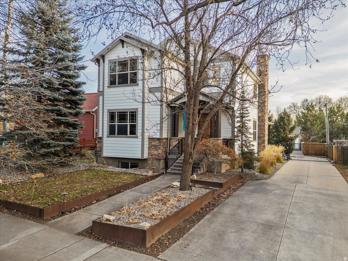 Located near downtown Salt Lake City and the University of Utah, this property offers exceptional access to major hospitals, TRAX, freeway connections, and an easy commute to the airport. Coffee shops, dining, and everyday amenities are just steps away, creating a convenient and connected lifestyle.  Constructed on one of Salt Lake City's remaining vacant lots, this stick-built home offers the advantages of newer construction in an established area where opportunities like this are increasingly limited.  This home offers three distinct living spaces with a total of 5 bedrooms and 5 bathrooms. The lower-level apartment features 2 bedrooms, 1 bathroom, a family room, kitchen, laundry, and a separate walk-out entrance, offering rental income potential.  The main home spans the upper two levels and includes 3 bedrooms and 4 bathrooms, including a main-level ensuite bedroom and additional powder room. The open great room connects the kitchen, dining, and living areas, creating a seamless flow for everyday living and entertaining. An additional loft or family room provides flexible space for a second living area, office, or media room, along with a private deck extending the living space outdoors.  A rare three-car garage with power gate provides valuable off-street parking, and the low-maintenance design makes this property easy to own and enjoy.  Square footage provided as a courtesy estimate. Buyer to verify all information.