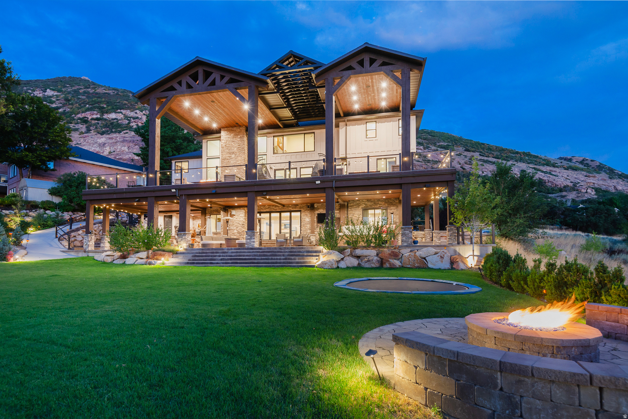 Spectacular Draper Luxury Home with One-of-a-Kind Views Better than new, this fully renovated masterpiece offers unparalleled panoramic golf course and mountain views through oversized windows and expansive Caribbean doors. Enjoy over 2,500 sq ft of decks and covered patios, complete with a relaxing hot tub, tranquil water feature, and mature fruit trees. Inside, the dramatic two-story granite fireplace anchors the open living area, while the gourmet kitchen impresses with high-end finishes, a hidden pantry, and premium appliances. The walk-out lower level boasts a state-of-the-art theatre room and direct backyard access, perfect for entertaining. A backup generator provides added peace of mind. Every detail has been crafted for luxury, comfort, and entertaining, making this home a rare find in Draper. *Square footage provided as a courtesy. Buyer is advised to obtain independent measurements and verify all information.*