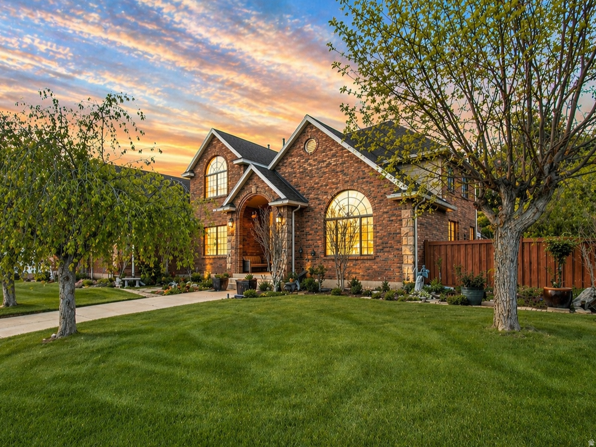 LOCATION JEWEL - where people stay for a lifetime!  RARE listing in the coveted and quiet, well-cared-for COUNTRYSIDE neighborhood filled with beautiful homes, tree-lined streets and velvet green lawns - in the heart of Orem - close to everything you'd ever need.  SOLID brick two-story home.  NEW ROOF and NEW HVAC.  Spacious, fully fenced yard and patio, three-car garage, seven bedrooms, hardwood floors and beautiful solid wood cabinetry, doors and trim.   A grand front staircase draws you in with a wide open balcony above, keeping both the entry and upstairs light and airy.  The spacious office off of the entry has a wall of built-in bookshelves and privacy French doors.  The expansive kitchen and island connects to a sun-lit dining area, with windows all around, gazing out to the backyard patio.  The spacious family room and fireplace off the kitchen has it's own back staircase leading upstairs and French doors that access the backyard.  Upstairs boasts four wonderful bedrooms and two full baths, including the Primary bedroom and laundry room.  Walk-in closets everywhere - the storage areas throughout the home are countless.  Double doors lead to the primary bedroom, with his and her vanities, enormous jetted tub surrounded by windows, a separate shower, and his and her walk-in closets, each with built-in dressers.  Basement offers three more finished bedrooms and a full bath.  Extra large unfinished room in basement can be what you wish: kids' play room, storage, future family room, or future-income generating apartment if desired.  Make this forever family home your own, in a LOCATION you'll never regret.