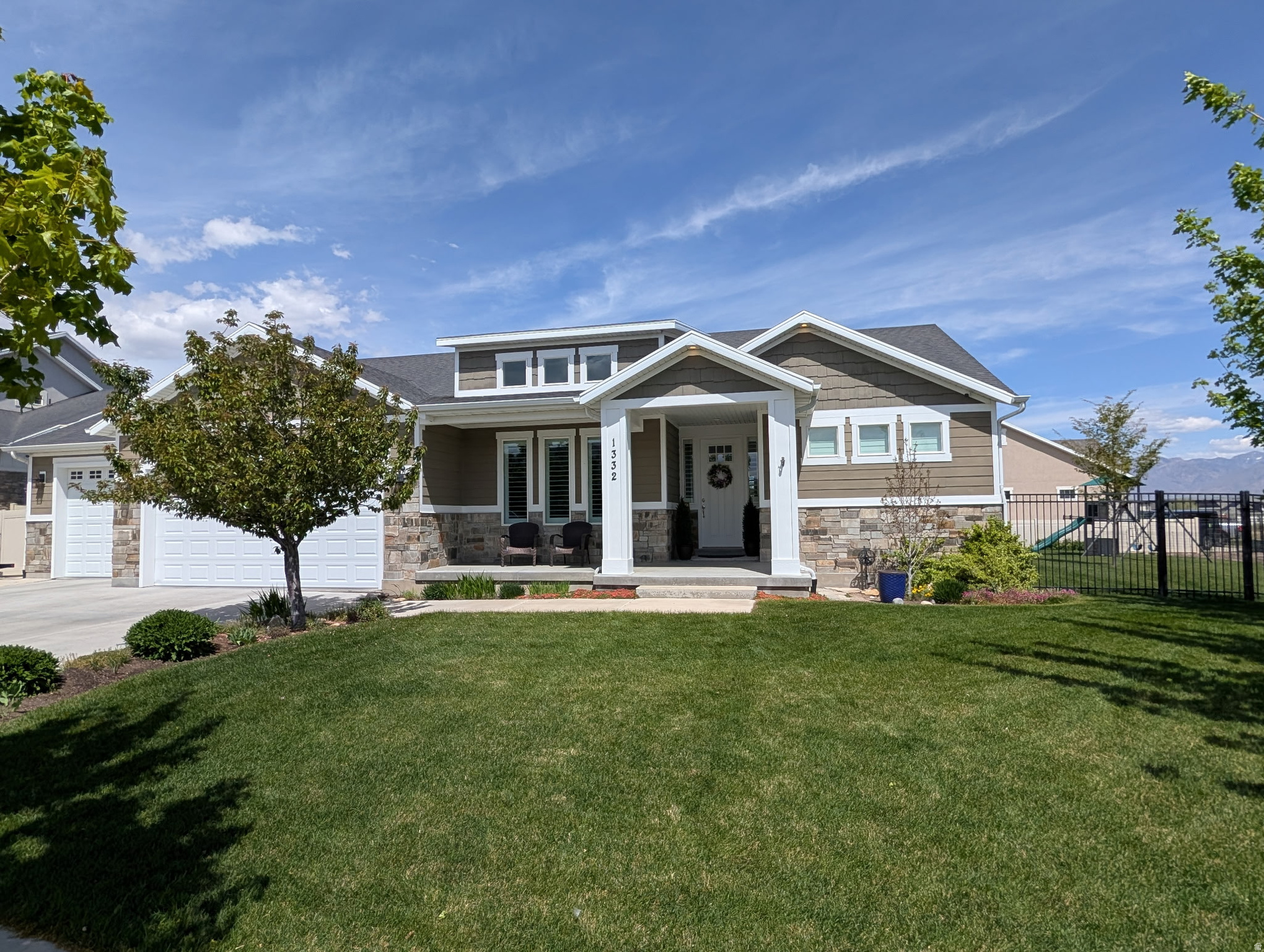 Coveted Bluffdale Sage Estates location. Beautiful, clean and well maintained home. The home is adjacent to the Jordan River Parkway trail system which offers 45+ miles of maintained hiking, biking, equestrian and fishing opportunities. Unobstructed Wasatch mountain views. Beautifully landscaped yard with a patio perfect for entertaining and plenty of afternoon shade for relaxing. The finished basement has a full second kitchen, private entrance and laundry room that can be used for multi-gen living or an $ADU. The home has an RV pad and a dream garage with a tandem 3rd bay that is extra wide and deep 15.5' x 43'.  The home has 3/4" solid oak hardwood flooring, lots of windows and natural light, walk in closets in all upstairs bedrooms a bonus room plus tons of storage space. Located close to shopping, dining, commuter access and entertainment.  Walking distance to the park with playground, pickleball/tennis courts and a splash pad. Ideal location!! Don't miss this rare opportunity.