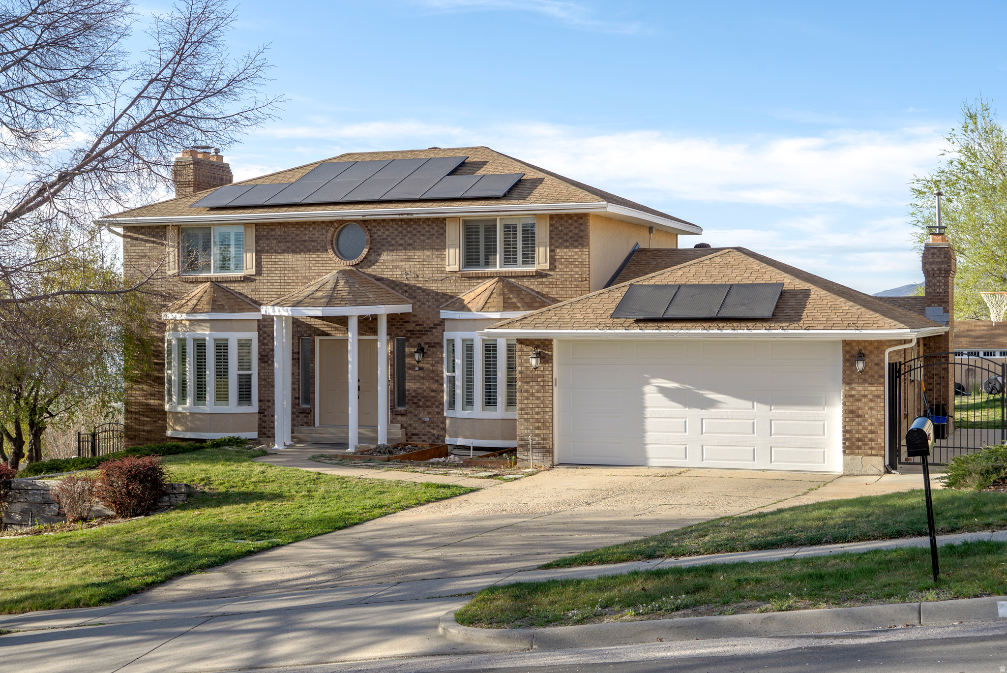 Imagine waking up every morning to sweeping panoramic views of the Great Salt Lake and the Wasatch Mountains, and ending the day with the most amazing sunsets that relax your soul - that's exactly what life looks like at 761 San Simeon Way. This isn't just a house; it's a home that inspires you to live, entertain, and relax in every corner. Step inside to the main floor, where light floods the space and every room feels open and inviting. The kitchen is a chef's dream, with a large island, tons of storage, and space to create meals while staying connected to family and friends. The formal dining room and two living areas, each with a cozy fireplace, make hosting effortless. And when it's time to enjoy the outdoors? The deck off the kitchen living room offers the perfect spot for morning coffee or sunset beverages too - all with those gorgeous views as your backdrop. Upstairs, the primary suite is your personal retreat, complete with a spa-like ensuite, walk-in closet, and more of those stunning views that make every day here feel special. Two additional bedrooms and a full hall bath provide plenty of space for family or guests. Need extra space? The finished basement apartment is a dream - perfect for a teen, in-laws, or rental income. With its own entrance, updated kitchen, living room, den/office, bedroom, bath, and laundry, it's a private little world all its own. Bonus: exterior storage with garage-door access keeps everything tidy and secure. Outside, the magic continues. The yard is a private oasis with fruit trees, berries, grapes, and garden space. Host friends under the gazebo, soak in the hot tub, or simply relax on the deck, taking in the panoramic views that stretch for miles. With an attached 2-car garage, plenty of off-street parking, and all this space for under $1M, this home is truly a rare find in Bountiful. It's a place where memories are made, sunsets are savored, and every day feels like a retreat. Don't just see this home - experience it. Your dream lifestyle is waiting in the Bountiful Foothills.