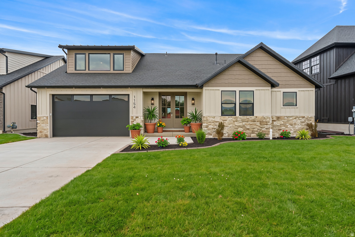 Experience refined mountain living in the coveted Heber Valley with this exceptional custom-built luxury home, where breathtaking views of Mt. Timpanogos provide the perfect backdrop for everyday living. Thoughtfully designed with timeless Craftsman architecture, impeccable craftsmanship, and designer-selected finishes throughout, this stunning residence offers the perfect blend of elegance, comfort, and functionality. The heart of the home is a spectacular gourmet kitchen featuring quartz countertops, custom cabinetry, premium appliances, and an oversized island that seamlessly connects to the expansive great room-creating an ideal space for entertaining. Rich Craftsman millwork, detailed trim, designer lighting, elegant ceiling treatments, and high-end finishes reflect the superior quality and attention to detail found throughout. Designed with versatility in mind, the main level features two luxurious primary suites, each complete with spacious walk-in closets and spa-inspired en-suite bathrooms-perfect for multi-generational living, long-term guests, or those seeking the convenience of main-level living. Upstairs, you'll find two generously sized bedrooms connected by a beautifully appointed full bathroom, along with two spacious loft areas that provide endless possibilities for a home office, fitness studio, reading lounge, playroom, or additional gathering space. Additional highlights include an oversized mudroom with custom built-ins, a spacious laundry room with custom cabinetry, energy-efficient construction, premium windows, and abundant storage throughout. Step outside to the grand covered patio, where you'll enjoy spectacular views of Mt. Timpanogos while relaxing or entertaining in the beauty of Utah's mountain landscape. The unfinished basement offers exceptional potential, providing ample room to grow with space for additional bedrooms, a theater room, fitness area, game room, or customized living spaces designed to fit your lifestyle. Located in one of Utah's most sought-after mountain communities, this exceptional home is just minutes from world-class skiing, championship golf, blue-ribbon fly fishing, boating at Jordanelle and Deer Creek Reservoirs, hiking, biking, and countless year-round outdoor adventures. With convenient access to Deer Valley East Village, Park City, shopping, dining, and Salt Lake City, you'll enjoy the perfect balance of luxury, recreation, and convenience. Builder and preferred lender incentives may be available. Contact the listing agent for complete details and current incentive offerings.  All details about the home, including square footage figures, are provided as a courtesy estimate only and were obtained from floor plans.  Buyer and buyer's agent are advised to obtain an independent measurement.