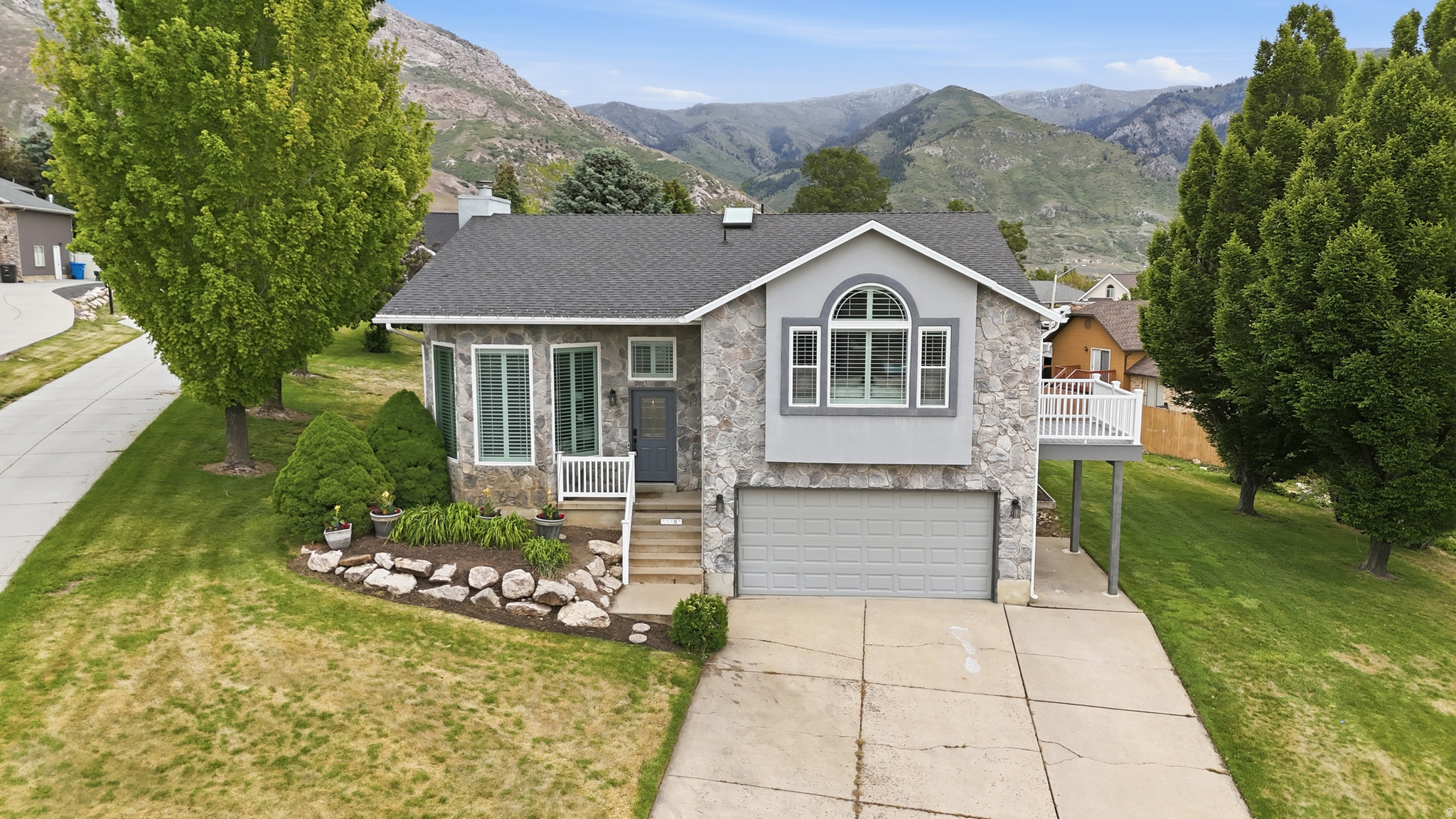 Completely updated and spectacular mountain views in North Ogden! This exceptional property sits on over 1/3 of an acre with so much to offer both inside and out. Step inside to new flooring, new paint throughout and a beautifully updated kitchen with granite countertops! The primary bedroom serves as a true private escape, complete with its own balcony offering views of Ogden Canyon and the valley. Downstairs, a fully independent second living area with its own kitchen and laundry room presenting a fantastic setup for guests, extended family, or potential rental income. Finished with a "bonus" basement area with tons of additional storage space, this versatile home delivers incredible utility alongside its picture-perfect backdrop. Call for a showing today!  Square footage figures and all information provided as a courtesy estimate only, Buyer and Buyers Agent  advised to obtain independent measurement and verify all information.