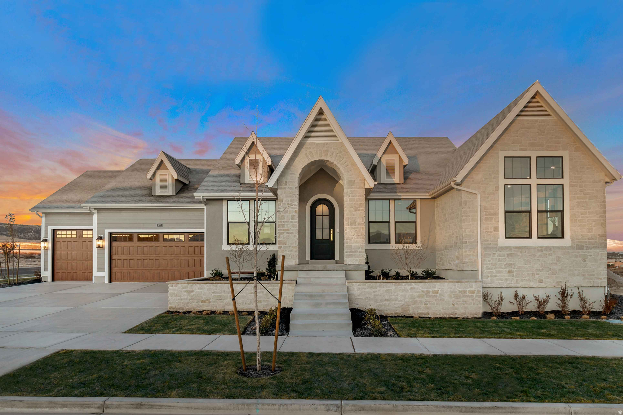 LOT#140. Symphony Homes stunning model home, the popular 'Harrison' plan, with a European Romantic exterior/elevation. Loaded with lots of upgrades and features, and incredible interior design and craftsmanship. Beautiful kitchen with high-end appliances and a walk-in butlers pantry. Custom millwork. Premium LVP flooring. Separate living room and an office off the entry. Amazing Primary Suite featuring a huge custom wardrobe room with serious "wow" factor, which features hookup for a stackable washer/dryer, and an incredible spa-like bathroom with free standing tub and oversized shower with built-in bench! Laundry room with sink. 12' ceiling in family room, and built-in shelves on each side of the fireplace. Basement features a finished gym with rubber floor and mirror wall, a media/theater room, and beautiful wet bar. Large covered patio. 3rd stall of garage is 34' deep. Tons of storage throughout. Gorgeous details throughout! See agent remarks about closing/possession details.