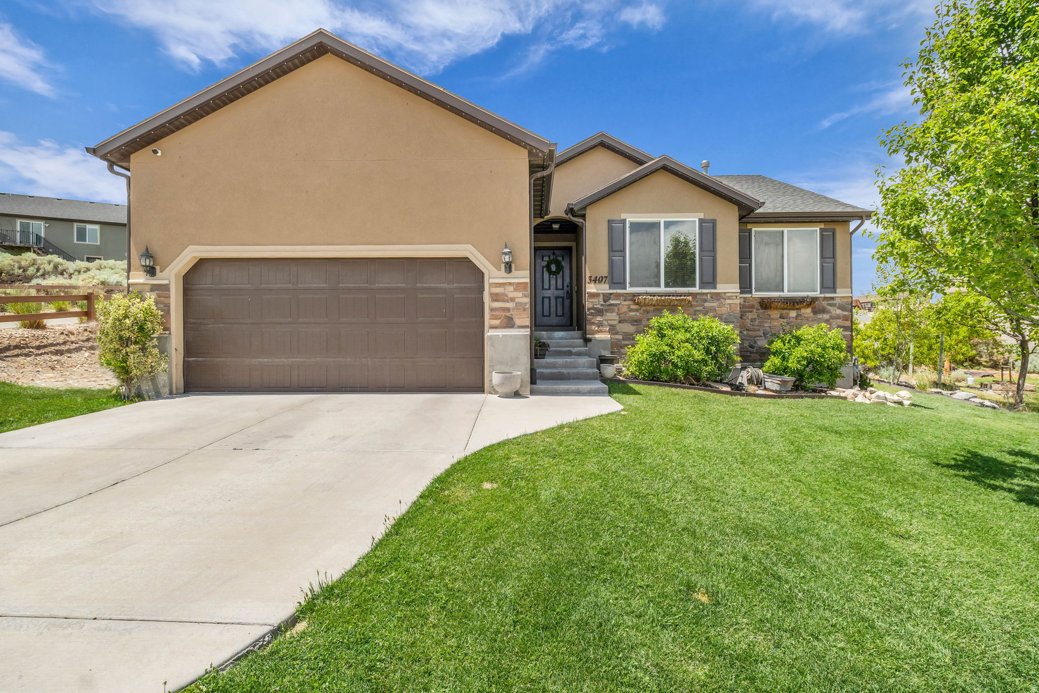 Back on market due to buyers inability to perform. Preferred lender is offering a 1/1 buy down to help you get the best interest rate possible! Use it toward closing costs or an interest rate buy-down to get the perfect payment. Welcome to your beautiful 4-bedroom rambler, perfectly situated to capture stunning lake and mountain views. This home has been lovingly maintained and is ready for its next owner to call it home. Enjoy peaceful evenings in the spacious backyard, enhanced by elegant LED lighting-ideal for outdoor dining or entertaining under the stars. Inside, the open and inviting floor plan provides comfort and functionality, while the large basement offers plenty of space for gatherings, recreation, or future customization.   Square footage figures are provided as a courtesy estimate only and were obtained from county records. Buyer to verify all.