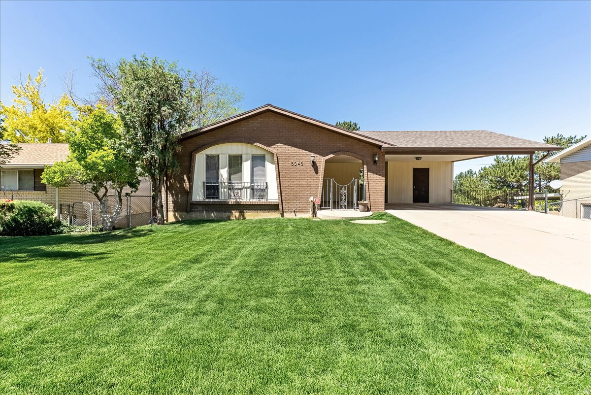 Discover the perfect blend of space, flexibility, and stunning views in this spacious 5-bedroom rambler, nestled in a beautiful, established Roy neighborhood. Perched above the Hooper Valley with sweeping views of the Great Salt Lake, this home offers room for everyone and endless possibilities.  Designed with versatility in mind, the home features separate parking areas for both the upper and lower levels, making it ideal for multi-generational living, rental income potential, or simply giving everyone their own space. The expansive backyard provides the perfect setting for relaxing evenings, entertaining friends and family, and taking in breathtaking sunset views.  Conveniently located just minutes from I-15, you'll enjoy quick access to shopping, dining, recreation, and commuting throughout Northern Utah. Major updates include a roof that is only four years old and a newly replaced main sewer line, and $5,000 carpet allowance offering added peace of mind for years to come.  Opportunities like this don't come along often-schedule your showing today and see everything this exceptional property has to offer.   Square footage figures are provided as a courtesy estimate only and were obtained from an appraisal.  Buyer is advised to obtain an independent measurement.