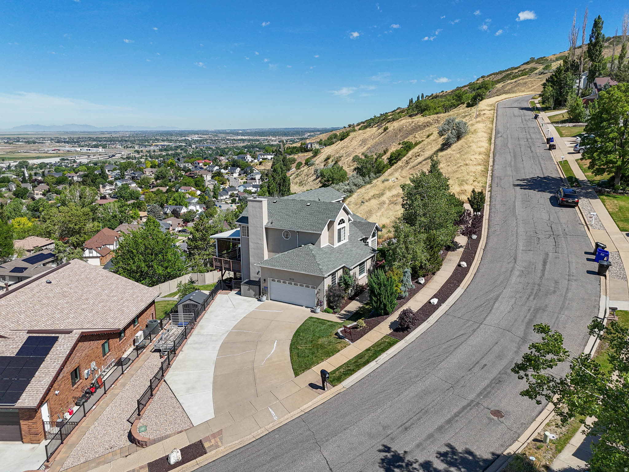 PRICE DROP! OPEN HOUSE SATURDAY JUNE 27TH 12-2PM**Beautiful home on the East bench with gorgeous views from the multi decks facing West!! Walk out your front door to hiking and waterfall within a few minutes! Don't miss this charming home with wrap around granite countertops in the chefs kitchen with bar seating and formal dining. Dark cherrywood custom cabinets, all new appliances and fixtures. Master suite with a soaking, jetted tub, dual sinks and a stone fireplace. Theater space with wet bar and walk out to the bottom deck with more views! Sunset views along expansive decks! Multiple storage sheds, zen garden, meticulously cared for inside and out! Square footage figures are provided as a courtesy estimate only. Buyer is advised to obtain an independent measurement.