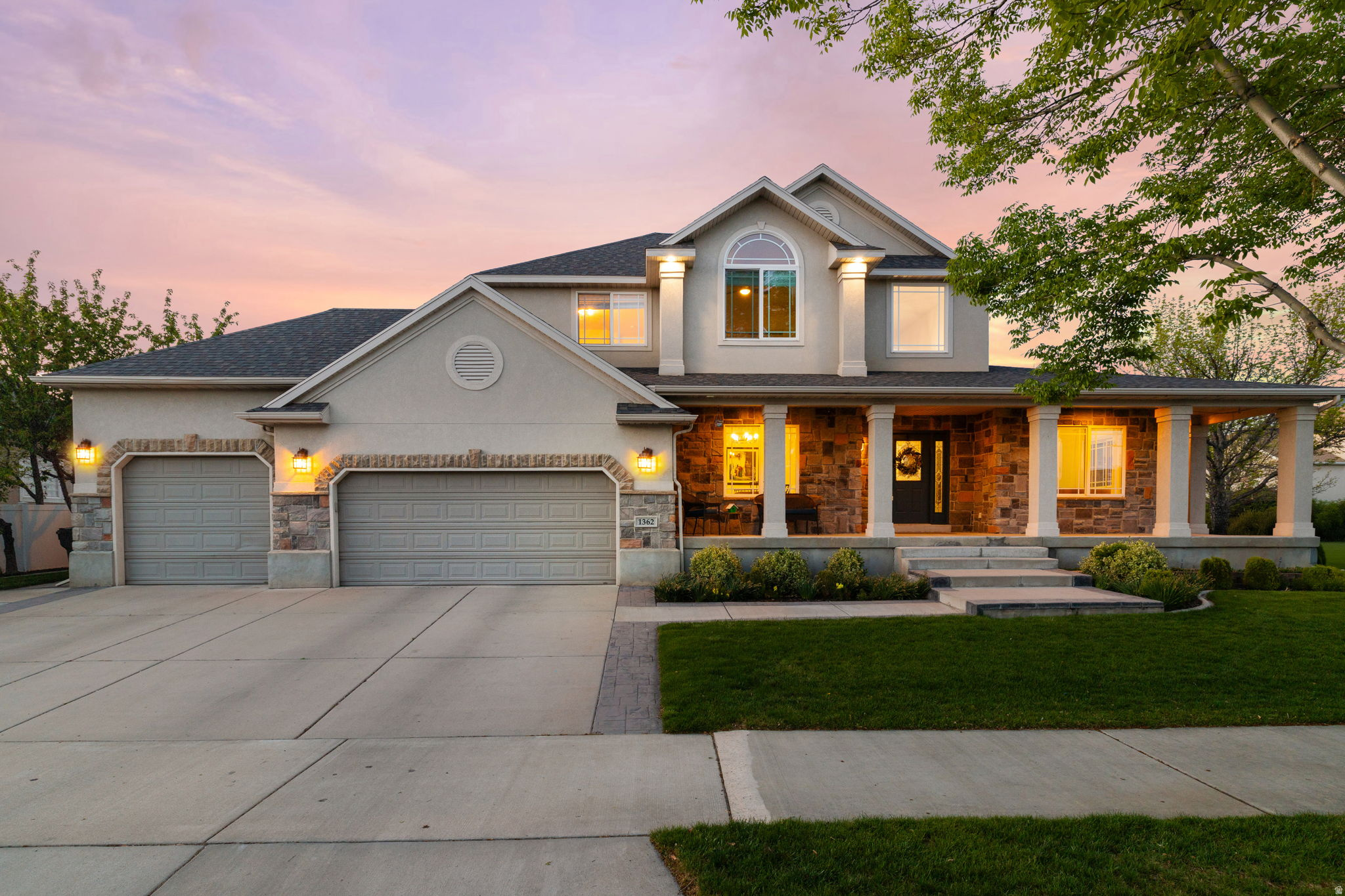 Stop the car! Beautifully updated executive home on a cul-de-sac in Provo's sought-after Grandview neighborhood. Built by Ivory Homes and substantially remodeled in recent years, this home offers exceptional space, style, and function. Recent updates include new paint on the main and upper floors, new flooring, updated lighting, and new stair railings. The gourmet kitchen features custom lacquered cabinetry, soft-close drawers, a new island with quartz countertops, custom backsplash, double ovens, gas range, new appliances, and generous prep space. Enjoy a cozy great room with a new fireplace mantel and plenty of room to gather and relax. The spacious main-floor primary suite features vaulted ceilings, elegant wainscoting, and a luxurious bath with a freestanding tub, separate shower with European-style glass, double vanity, and an oversized split closet. The main floor also includes a flexible front living room or office currently used as a game room, a formal dining room, and a beautifully remodeled half bath. The laundry room features new flooring, hanging bars, and storage hooks.All main-floor and upper-level bathrooms have been remodeled with updated vanities and flooring. The fully finished walkout basement features a wide 4-foot staircase, 8-foot ceilings, a full second kitchen with island, a large family room wired for home theater, and an exercise room. Additional highlights include 200-amp service, two furnaces, water heater replaced in 2023, an oversized 3-car garage with an extra-deep third bay, suspended garage storage, stamped concrete, backyard pond with a new pump, and raised garden beds with dedicated irrigation. A rare opportunity to own a thoughtfully updated home in one of Provo's most desirable neighborhoods.   Square footage figures are provided as a courtesy estimate only and were obtained from previous listing.  Buyer is advised to obtain an independent measurement.