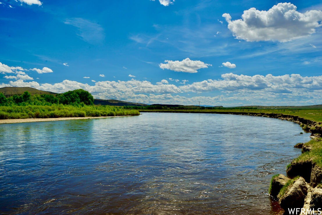 HISTORIC HAYSTACK RIVER RANCH: NORTH PLATTE RIVERFRONT LEGACY 92,447 Acres | Miles of North Platte Riverfront | Profitable Cattle Operation | Premier Wyoming Recreation  A rare opportunity to acquire one of Wyoming's most significant ranch holdings, where legendary Western history meets modern investment potential. Haystack River Ranch combines productive agriculture, world-class recreation, and multiple revenue streams in an iconic Wyoming landscape. PROPERTY HIGHLIGHTS   92,447 Total Acres: 25,000 deeded acres, 40,960 BLM permitted acres, 23,527 private lease acres Water Resources: Miles of North Platte River frontage, hundreds of irrigated/sub-irrigated meadows, 30 stock ponds, numerous springs Proven Production: Supports 9,000+ AUMs with low overhead operations Complete Infrastructure: Two homes, calving/vet barn, feedlot, horse barn, outbuildings Current Income: Multi-year cattle lease providing immediate return on investment Investment Potential: Wind rights, carbon credits, conservation easements, recreation development Premier Recreation: Trophy fishing for browns, rainbows, cutthroats and walleye; excellent big game hunting (elk, pronghorn, mule deer); upland birds and waterfowl  OPERATIONAL FEATURES  Historically operated with cattle wintering in the southern portion and summer grazing in the north, with supplemental feeding typically December through April. Recently successful as a yearling operation. The diverse landscape at 7,000 feet elevation creates the perfect "Wyoming mix" of river bottomlands, irrigated meadows, sagebrush uplands, and rocky mountain terrain. LOCATION & ACCESS  Located just outside Rawlins (population 8,000), with full amenities including hospital, retailers, and restaurants. Excellent accessibility via Interstate 80 and Rawlins Municipal Airport. Near the famous "Miracle Mile" fishing destination and Seminoe Reservoir. This extraordinary property embodies the authentic Western legacy, standing at the crossroads of Wyoming's storied past of Native Americans, fur trappers, railroaders, and outlaws. Haystack River Ranch offers not just a cattle operation, but a piece of American heritage with substantial appreciation potential.