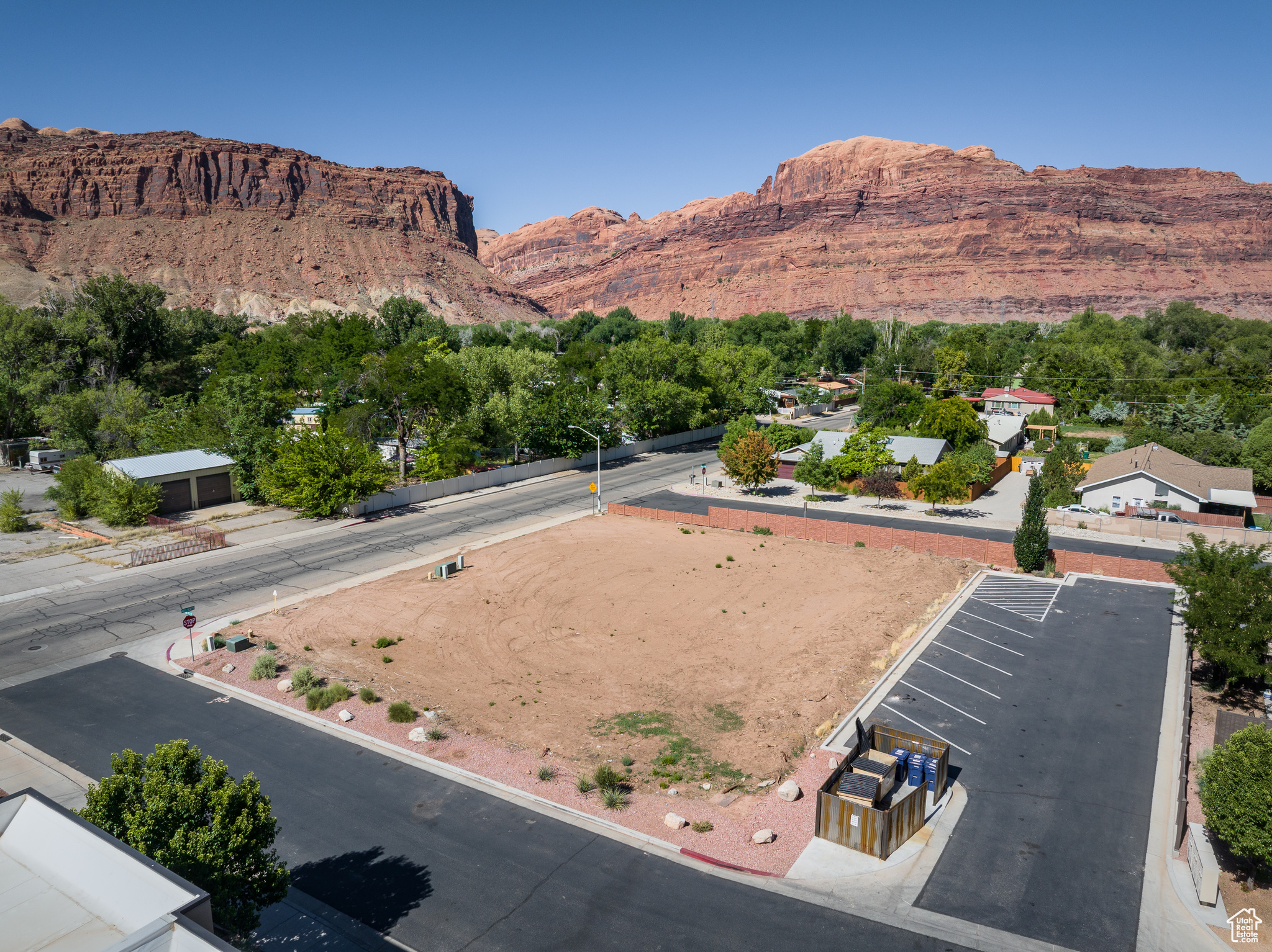 NEIGHBORHOOD COMMERCIAL LOT - This corner lot is located on the northwest side of the City of Moab surrounded by beautiful residential townhomes with incredible access to the center of town. This level and site-ready lot has all municipal utilities easily accessible for you to get started on your project! Commercial 2 zoning grants opportunities for clinics, professional office spaces, retail, outfitter services, restaurants, multi-family housing, mixed-use, long-term residential rentals and more! Offering Seller Financing!