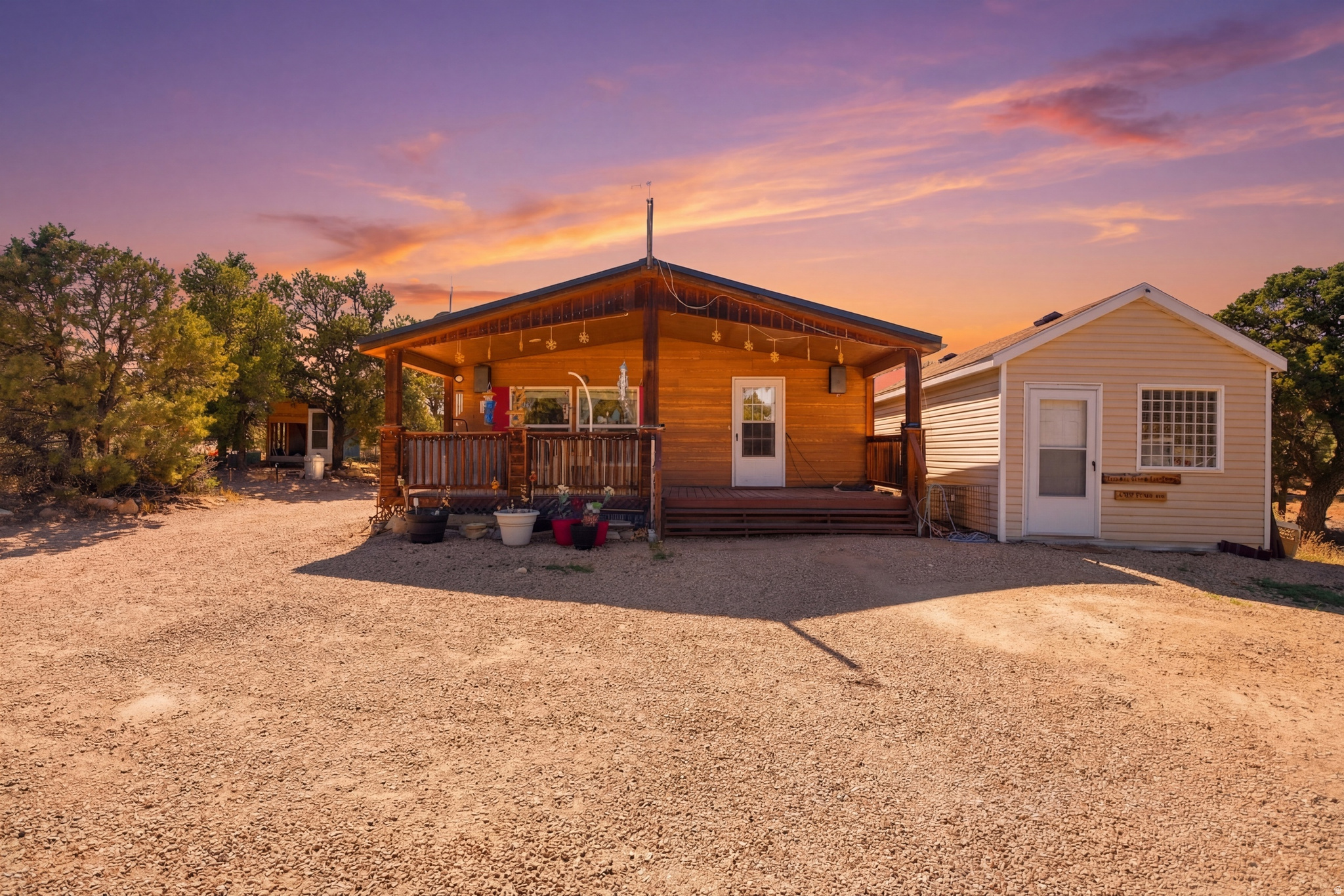 Back on the Market!! Welcome to your dream retreat! Nestled on 5.78 acres of serene land, this charming 2 bedroom 2 bathroom home offers both privacy and comfort. Enjoy peaceful views from every corner, plus direct access to your own water well. The property also features a large quonset hut and a variety of outbuildings perfect for storage, hobbies, or a workshop. And for the outdoor enthusiast you'll love being close to local reservoirs, perfect for fishing or boating. Whether you're seeking a tranquil escape or room to grow, this property is a true gem. come see it today!    Square footage figures are provided as a courtesy estimate only and were obtained from county records .  Buyer is advised to obtain an independent measurement.