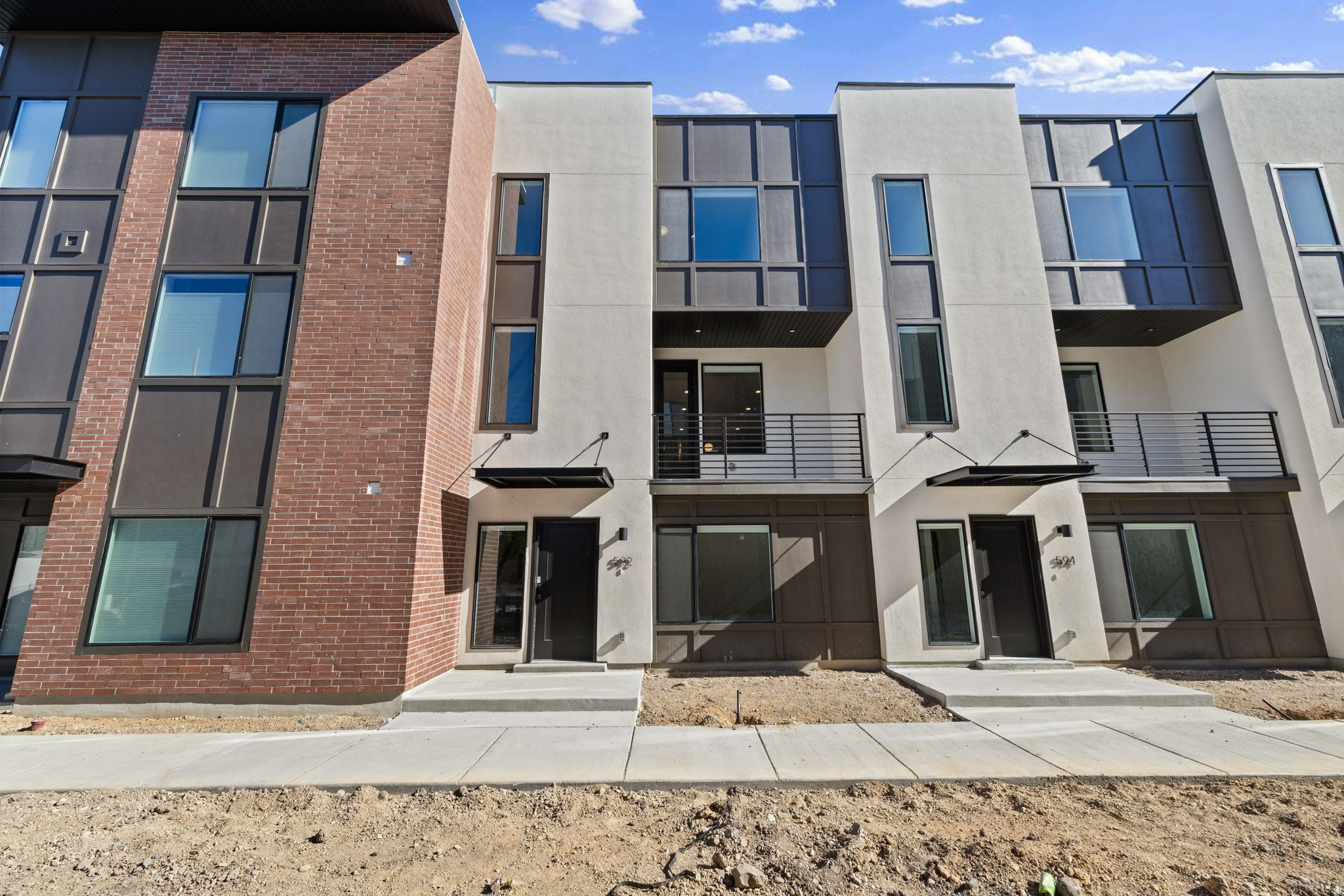 Experience modern, low- maintenance living at theMonroe, a thoughtfully designed townhome community in Salt Lake City's desirable Millcreek neighborhood. This Type C interior unit offers approximately 1,533 sq ft with 2 bedrooms and 2.5 bathrooms across three well- designed levels. The open- concept main floor features a stylish kitchen, dining, and living area that opens to a private balcony, ideal for everyday living or entertaining. Designer-curated finishes include 9' ceilings, quartz countertops, 42" upper cabinets, LVT flooring in main living areas, Stainless steel appliances, and included washer, dryer, and refrigerator. The home also features an attached 2 car garage and flexible entry-level space. Community amenities include pickleball courts, a playground, a gathering center and a dog bark, offering both recreation and connection. Conveniently located near shopping, dining, and TRAX/ light rail, and major commuter routes. Schedule your tour today and discover refined townhome living at theMonroe.