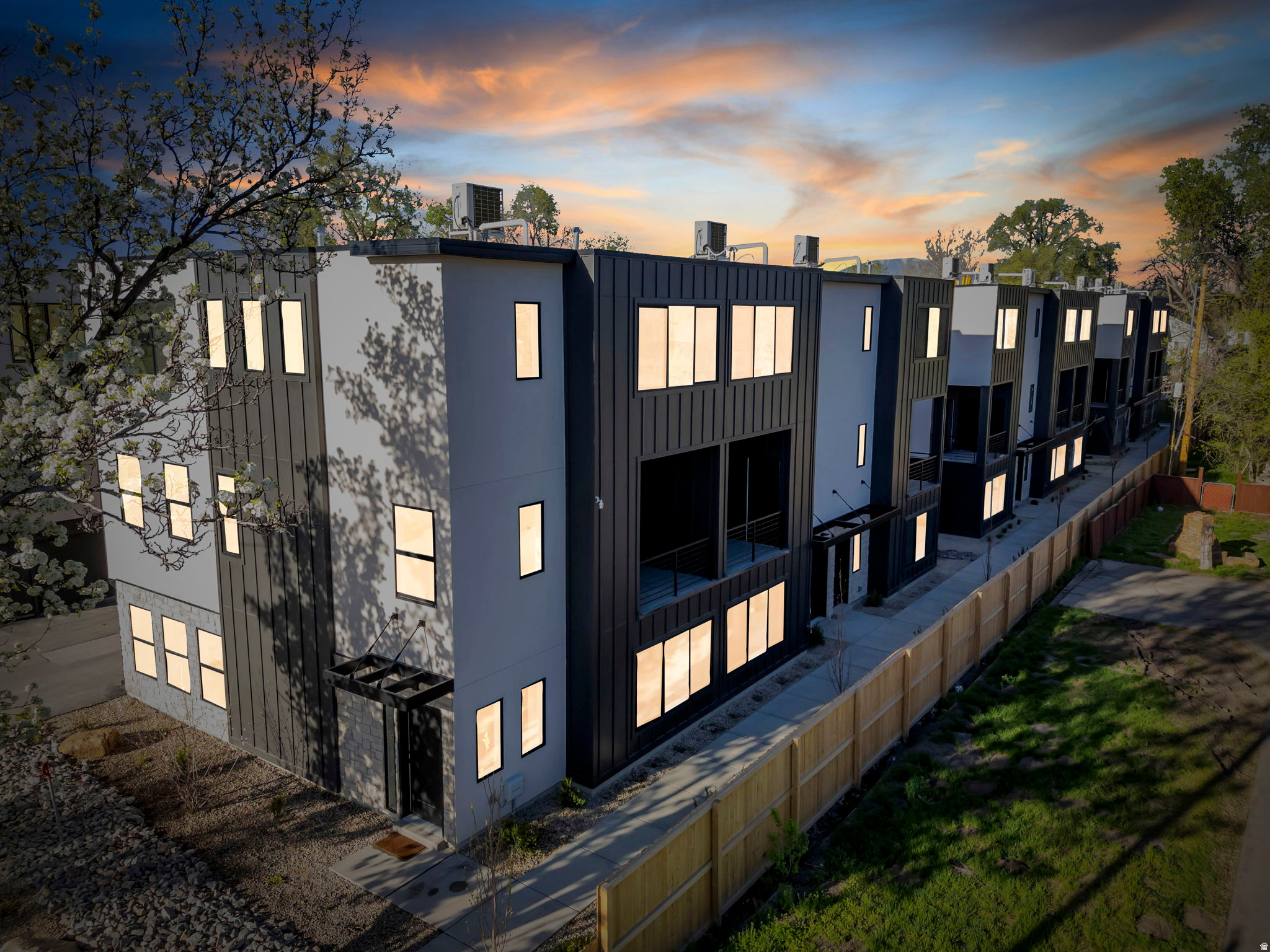 These move-in-ready townhomes are ideally located just 8 minutes from downtown SLC and the airport, with quick access to Liberty Park, the International Peace Gardens, and Glendale Golf Course. Inside, the home offers 4 bedrooms, 2.5 bathrooms, and 1,756 sq ft of thoughtfully designed living space-making it one of the largest townhome options you'll find this close to the city without the premium price tag. The modern kitchen features quartz countertops, quality appliances, ample storage, and abundant natural light. The primary suite includes a well-appointed, luxury bathroom. The private balcony offers outdoor space without the hassle of maintenance. Parking here is something you almost never find this close to downtown Salt Lake City. Each home includes a true two-car garage, along with additional community and street parking. It's a level of convenience that's hard to come by in downtown or near-downtown SLC, and it makes everyday living noticeably easier. Another major advantage: no rental restrictions from the HOA. Whether you plan to live in the home, rent it out in the future, or keep your options open, the flexibility is yours. Multiple homes are available and ready now-schedule a tour and see just how rare this opportunity is.