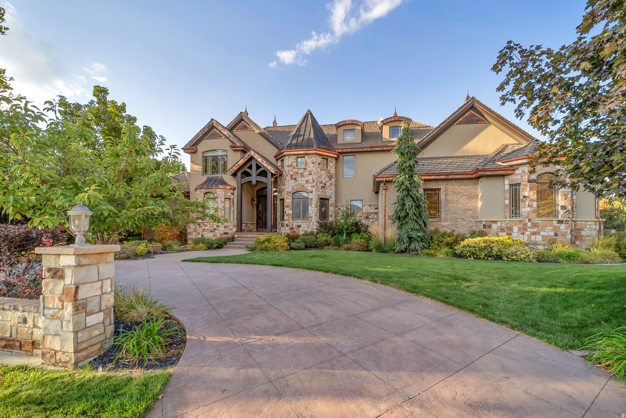BACK ON THE MARKET - sale failed - This exceptional luxury residence is the ultimate entertaining house.  It is situated on 1.24 acres featuring an amazing outdoor pool & hot tub, a pool house with bathroom, a two-story playhouse, a playground, a basketball court, a pasture area for horses, and still plenty of lawn & garden space. The heart of the home is a beautifully updated, modern kitchen, complete with high-end finishes, custom cabinetry throughout, and an extra-large hidden pantry-perfect for seamless organization and entertaining. The open layout flows effortlessly into multiple gathering spaces, including a large covered deck that overlooks the pool and is perfect for the family BBQ.   Designed for versatility, the home boasts additional recreation areas to suit a variety of lifestyles, along with an impressive basement kitchen ideal for entertaining or multi-generational living that flows into the theater room with ample seating, creating the ultimate experience for movie nights and hosting guests. Comfort and efficiency are top priorities, with two newer water heaters and three furnaces, including a recently replaced primary unit, ensuring reliable climate control year-round. The property also features solar panels that generate approximately 120% of the home's electricity needs, providing significant energy savings and greater sustainability. Car enthusiasts and hobbyists will appreciate the expansive 5-car garage, complete with built-in shelving for optimal organization.  Additional land is available for purchase across the street with a large barn & shed for additional storage.  See MLS -2145591