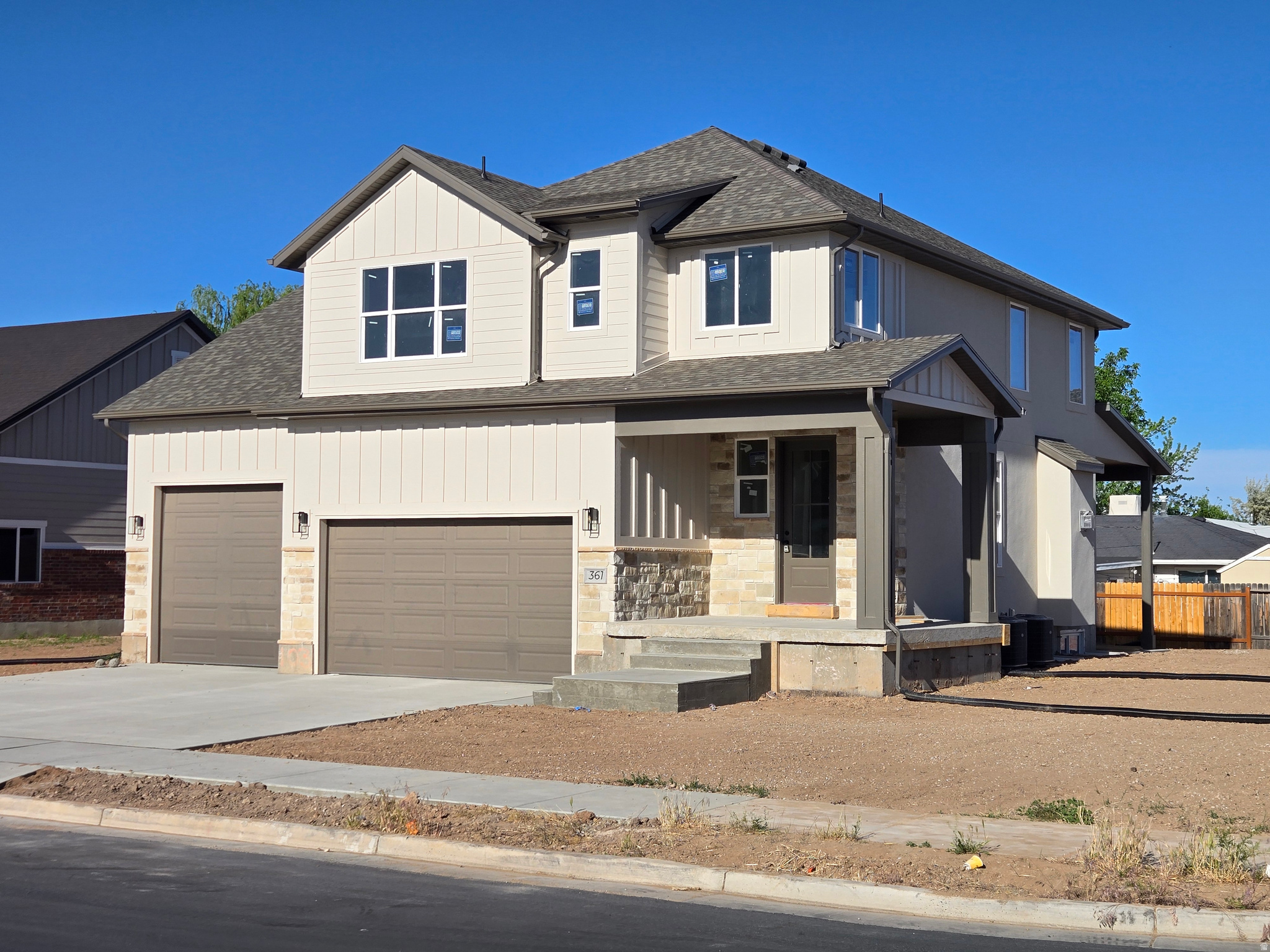 Castle Creek's newest custom two-story is almost complete and loaded with upgrades throughout. This stunning home features a wraparound porch, four-car garage, soaring two-story ceilings in the family room, oversized windows that flood the home with natural light, upgraded cabinetry, an 8-foot front door, oversized primary suite, covered patio, and so much more.   The unfinished basement offers room to grow with space for an additional family room, bedroom, bathroom, and plenty of storage.    Don't miss the final opportunity to own a new custom home in this fantastic West Point neighborhood. Conveniently located with quick access to the new highway and just minutes from parks, shopping, and schools.