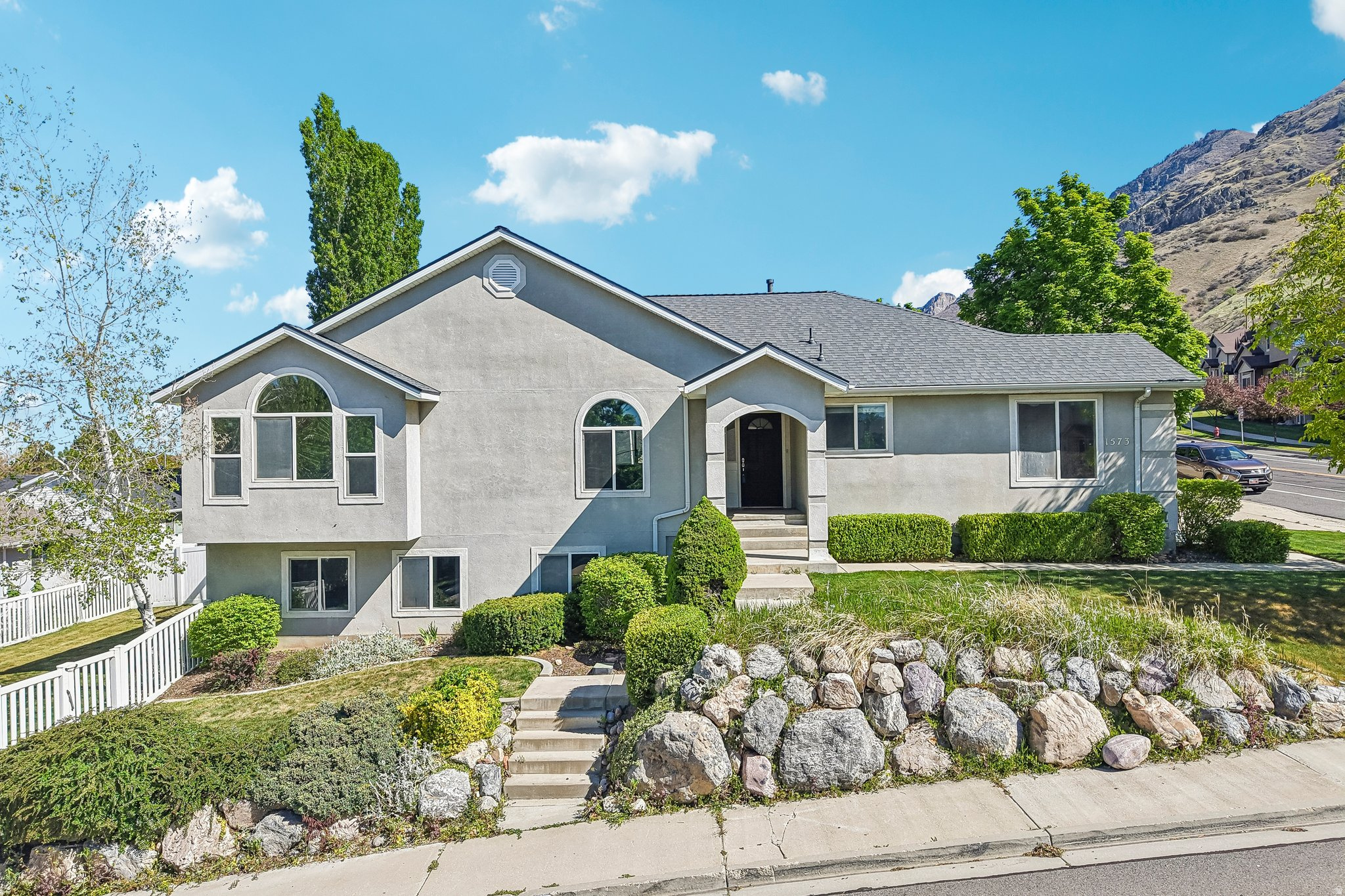 Great home in Provo with incredible mountain and lake views.  This home offers functional and comfortable layout with plenty of natural light throughout. The walk-out basement provides additional living space and flexibility for entertaining, guests, or a home office.  Enjoy the backyard with a private hot tub-perfect for relaxing and taking in the views.  Located in an established neighborhood close to schools, parks, shopping, and quick access to main roads and the freeway.   Rare combination of size, views, and location-don't miss this one.  Buyer is advised to obtain an independent measurement. Some of the photos have been virtually staged.