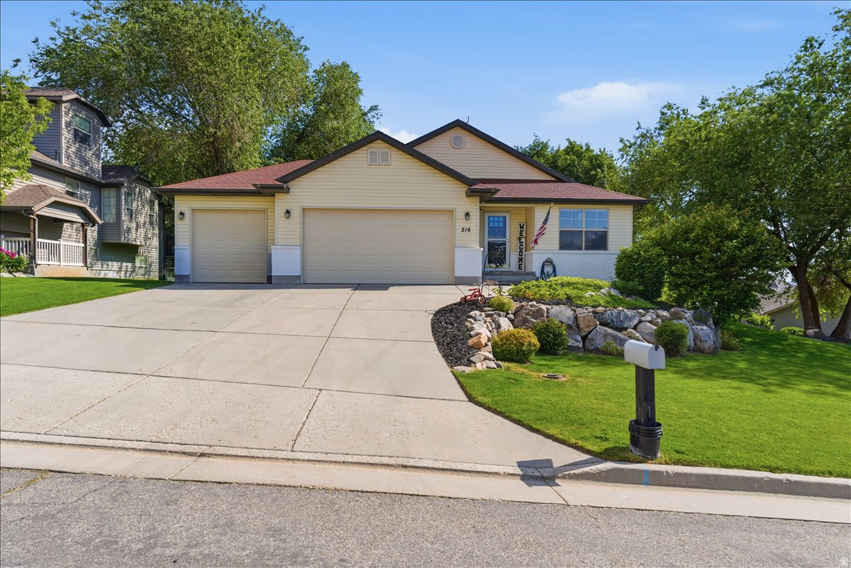 Beautifully maintained home in a great location! Home features a spacious layout, vaulted ceilings, wainscoting, new windows in 2024, double water heaters, updated kitchen with stainless steel appliances, lots of cabinetry and counter space, and tile backsplash. Generously sized bedrooms including a big master with double vanity, separate jetted tub/shower and walk-in closet in the bathroom. Main floor laundry room with cabinets for storage. Fully finished walkout basement provides excellent flexibility with potential for an ADU, already plumbed for a kitchenette. 3-car garage with overhead storage. Step outside on the brand new deck and prepare to be blown away by the beautiful landscaping surrounding the entire home. Mature trees providing shade for those hot summer days, and amazing mountain and Willard Bay views! There is an additional finished room with a closet (no window) in the basement. Every home has RV parking at the top of the hill. If you want to park more than one recreational vehicle up there, it can be parked tandem on the south end of the RV parking area.  Sellers use AC window units in kitchen and bedroom for comfort on really hot days. This helps balance the temperature and prevents the basement bedrooms from becoming uncomfortably cold while the central air is running. Sq. footage per previous listing. Property facts provided as a courtesy; Buyer to verify all information.