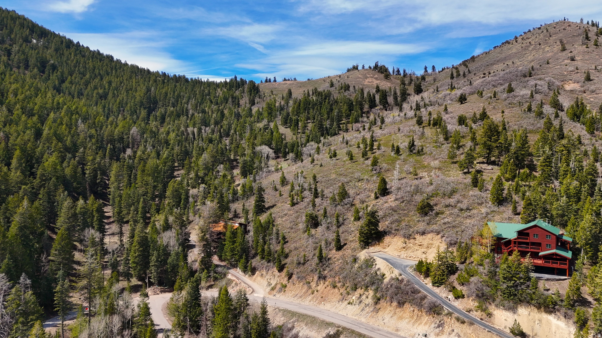 Prime uphill south facing lot with house plans included on one of Summit Park's quietest streets! Backing directly to open space and just steps from the Parkview trailhead, this property offers rare ski-in access in winter and effortless hiking and biking in summer-no car required. Summit Park is known for its extensive trail system and premier backcountry skiing.  An exceptional value with both mountain and valley views in one of Park City's most desirable neighborhoods. Located within the Park City School District and just minutes from Deer Valley, Park City Mountain Resort and Woodward. Save time and money with included plans for a three-bedroom, four-bath home featuring multiple dens and an open-concept living and kitchen area. Roads are county-maintained, and public utilities available. Don't miss this opportunity to build your mountain retreat in the heart of the Wasatch. HOA is voluntary. For more information, visit www.summitparkutah.net.