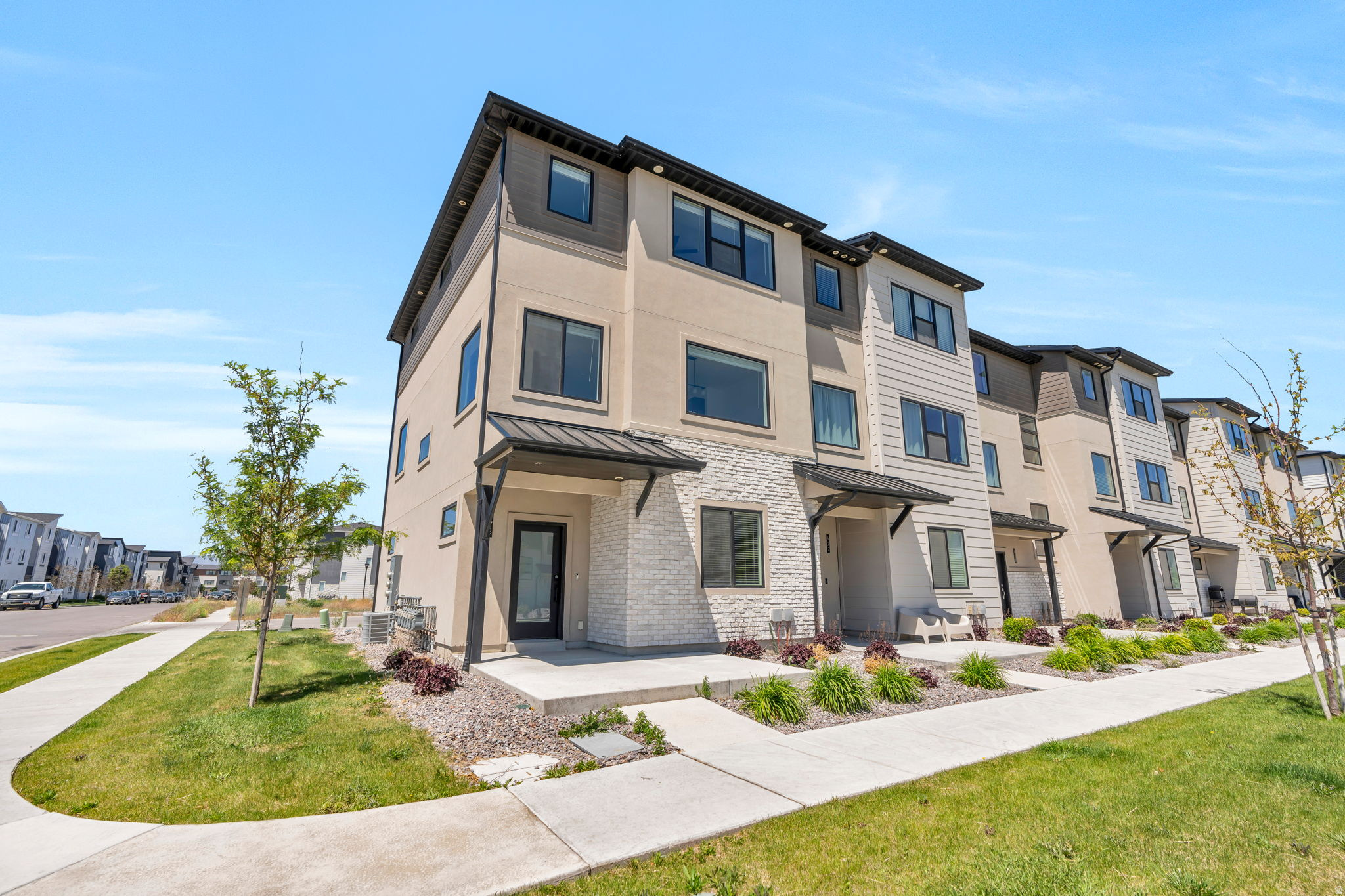 Priced to offer exceptional value compared to new construction in this area, this modern end unit townhome lets you move into the established Lakeshore Landing community on your timeline with no waiting. Modern end unit townhome in the Lakeshore Landing community of American Fork, available now and ready for immediate move in. The entry level features a bedroom and full bathroom, ideal for guests or a home office. Up on the main level, the kitchen features dark wood cabinetry, a gas range, built in dishwasher, and an oversized island with seating. The open concept layout flows seamlessly into the spacious living area with abundant natural light and a dedicated dining space. The top floor hosts the primary bedroom with gorgeous mountain views and an ensuite bathroom with dual sinks, a separate tub and shower, and a walk in closet. Two additional bedrooms, a full bathroom, and a laundry room round out the upper level. Enjoy a completed home with finished community amenities including a pool and pickleball courts, ready to enjoy right away. Commuters will love being just a short walk from the American Fork FrontRunner station, with quick connections throughout the Wasatch Front. Conveniently located just minutes from Walmart, Costco, shopping, dining, and I-15 access. Measurements provided as a courtesy only, buyer to verify all info.