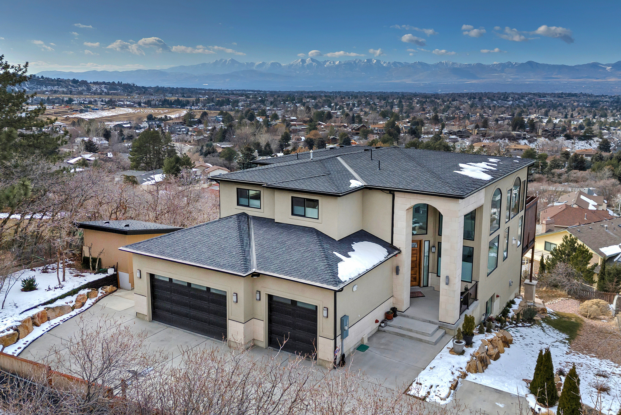 Tucked into a quiet cul-de-sac at the base of the Cottonwood Canyons, this custom-built home offers exceptional privacy, natural light, and sweeping mountain and valley views. With multiple outdoor living spaces, a spacious chef's kitchen, and flexible living areas, the home is designed for both comfort and connection, all just minutes from world-class skiing, canyon access, and downtown Salt Lake City.