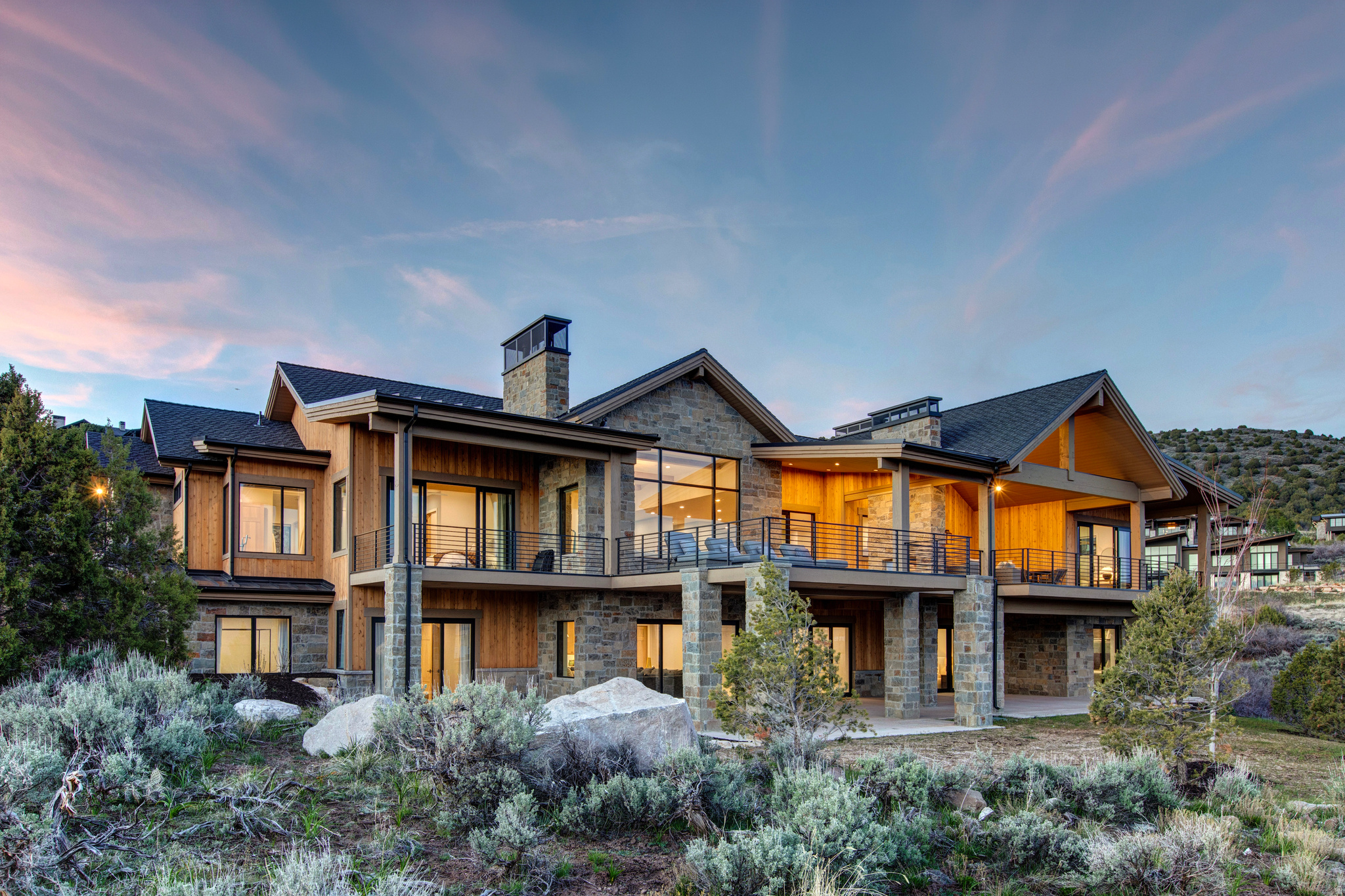 Positioned on 1.62 acres, 2566 E Boulder Top Way is an exceptional mountain estate thoughtfully designed to deliver elevated living through exceptional scale, refined finishes, and resort-inspired amenities. The residence offers 6 en suite bedrooms and 8 bathrooms with expansive gathering spaces created for both grand entertaining and everyday comfort. Dramatic ceiling volumes, clean architectural design, and seamless indoor-outdoor living create a home that feels both impressive and inviting, while large walls of glass frame mountain views and fill the interiors with natural light throughout the day. The gourmet kitchen is appointed with premium Wolf and Sub-Zero appliances and flows effortlessly into generous living and dining spaces designed to host on any scale. Every space throughout the home was intentionally designed to create connection while maintaining comfort, privacy, and livability. Curated as a true lifestyle retreat, the residence features a full private sports court and an entire wellness level dedicated to fitness, recovery, and relaxation, bringing a resort-quality experience into everyday living. The primary suite serves as a private sanctuary with spa-inspired living, while each additional en suite bedroom offers elevated accommodations for family and guests alike. Multiple entertainment and gathering spaces throughout the home provide flexibility for intimate evenings, larger celebrations, and effortless hosting. Located within Red Ledges and moments from world-class skiing and golf, this estate presents a rare opportunity to experience luxury mountain living at an extraordinary level.