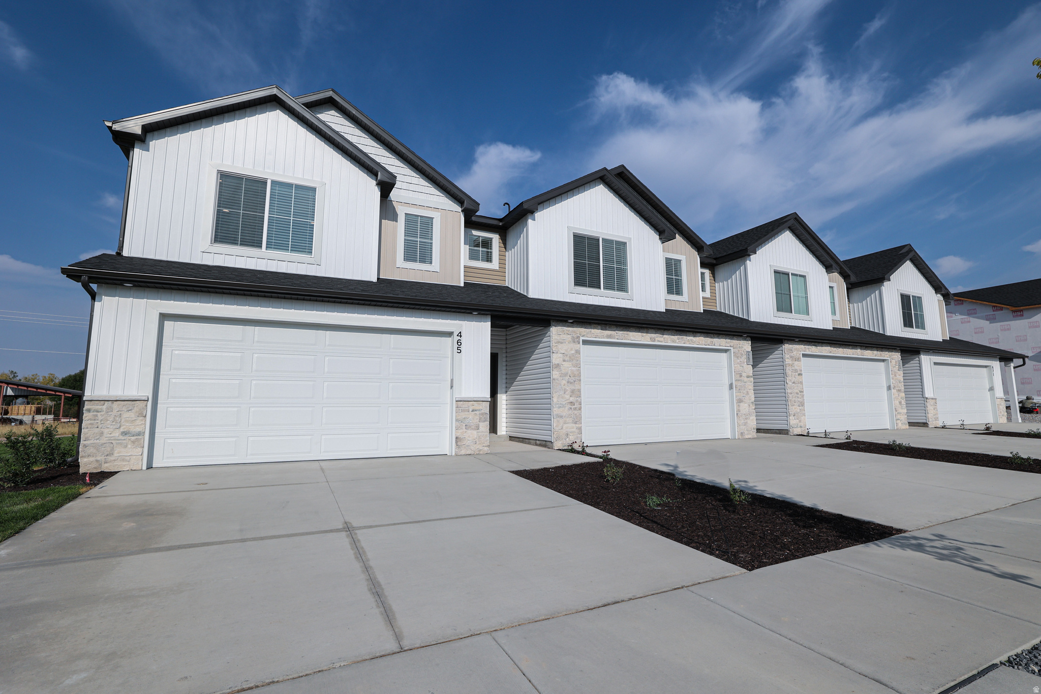 This unit is under construction and estimated completion is Sept 2026. Full length driveway allows for 2 large cars to be parked in the driveway and have 2 in the garage. The home has 3 bedrooms upstairs with a large Laundry room. At the top of the stairs is a desk area for the work from home station. Stainless steel appliances and Quartz countertops with cabinets to the ceiling in the kitchen for added storage. Large windows to take in the views of the north end of Cache Valley! Internet is included in the HOA fee. *Pictures are of previous completed unit, please be aware this unit will look identical but may be various stages of construction* This unit is an END unit.