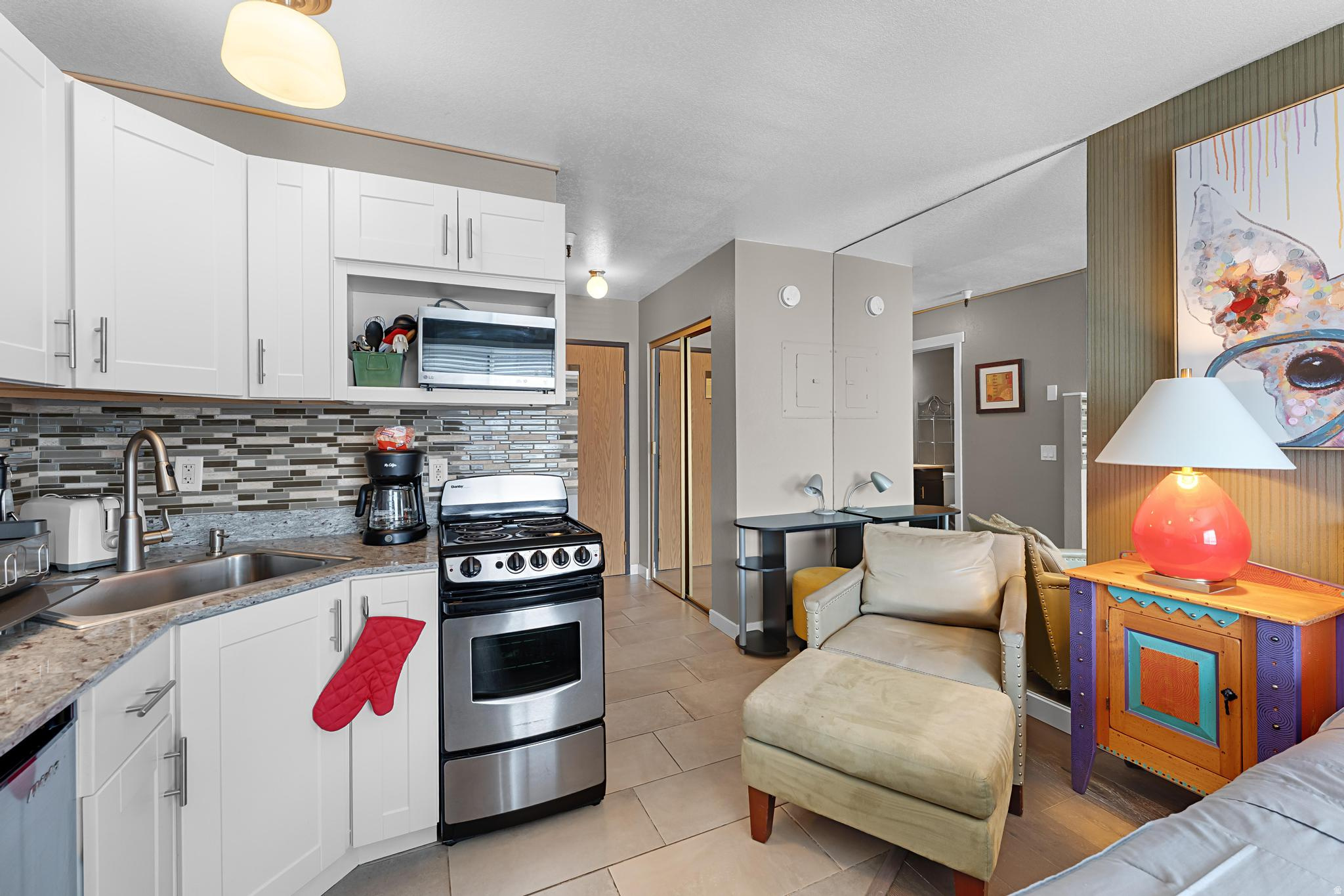 The best things come in small packages and unit 302 in Prospector's Carriage House is bringing all the love! This turnkey, updated studio on the third floor is perfect for an investor who wants an easy-to-maintain rental property or an individual who wants to stop throwing money at rent. Located in the heart of the commuter district. Close to all Prospector amenities, on the bus route and within a well-managed building with pool, hot tub, storage and laundry. The unit features new furnishings, upscale art deco vibe and the convenience of a kitchen with an oven/range, microwave and refrigerator. Window A/C. Owner has replaced the water heater. Secure building. Furnishings to be transferred with a separate Bill of Sale and PPTA.  HOA includes water, trash, internet/cable, snow removal and building maintenance. Electricity bills average $40/month.