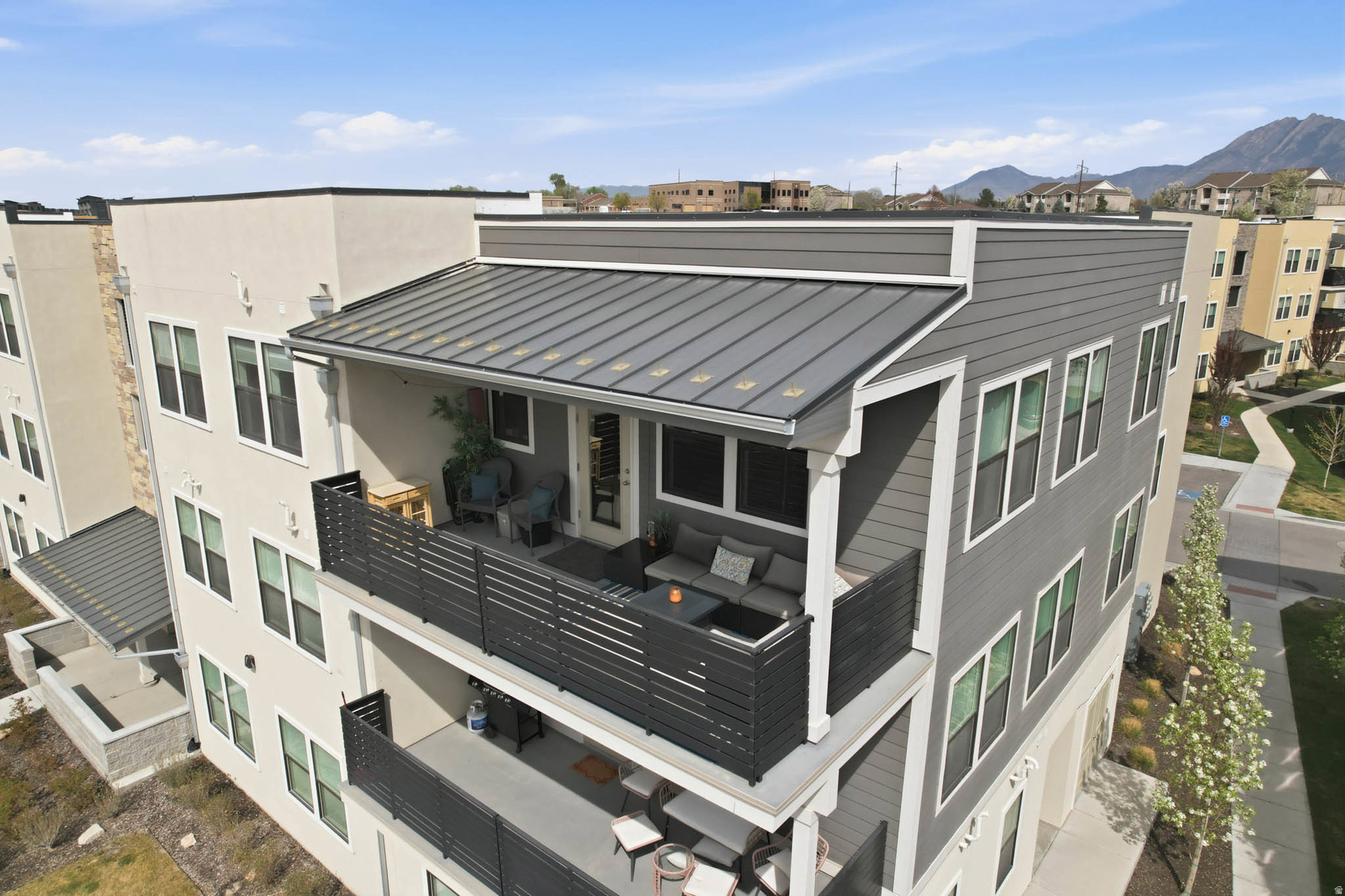 Welcome to this coveted TOP FLOOR CONDO - the only top-floor unit currently on the market in this community. Conveniently located in Midvale, it offers the privacy and views buyers desire with 3 bedrooms, 2 bathrooms, and an open-concept layout bathed in natural light. Perched above the neighboring units, the balcony delivers unobstructed pond views you may not find on lower floors. Move-in ready with all kitchen appliances included, plus a secure, extra-deep 2-car garage with additional storage. The HOA permits long-term rentals, making this a smart pick for homeowners and investors alike. Planned community amenities include a clubhouse, pool, and gym. Please view the virtual tour before scheduling a showing.