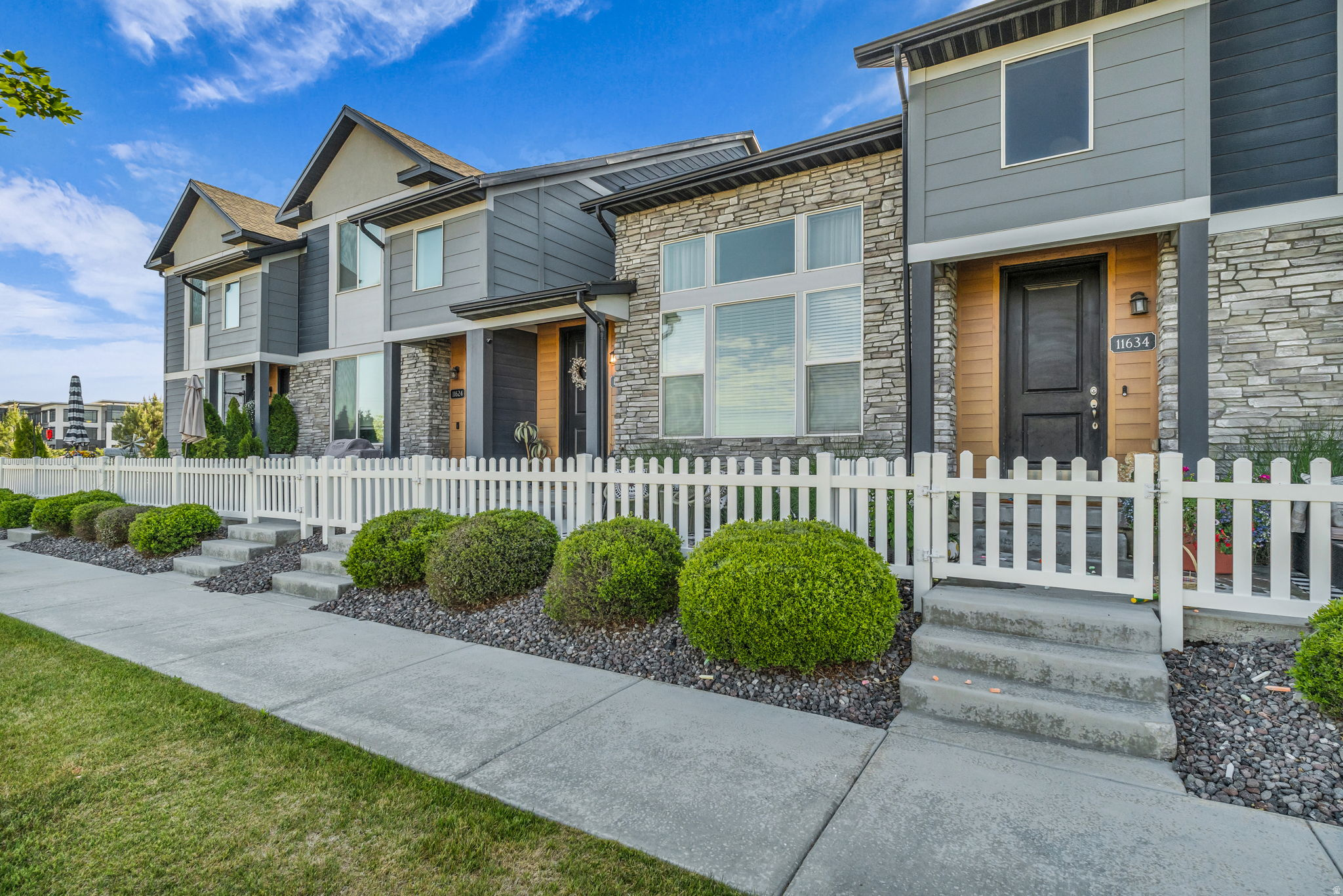 No showings until May 26h. This beautifully updated townhome offers an open, spacious floor plan with soaring vaulted ceilings and oversized windows that fill the home with natural light. The kitchen features stainless steel appliances, plus the refrigerator and washer/dryer are included for added convenience. Enjoy modern comforts like a tankless water heater, dual-zone heating and air, and thoughtful upgrades throughout. Step outside to your own private fenced courtyard, perfect for relaxing or entertaining. Located close to restaurants, shopping, and everyday conveniences, this home combines comfort, style, and an unbeatable location.