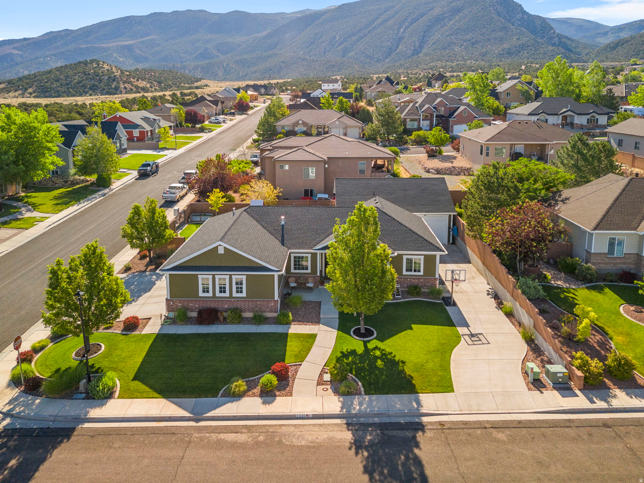Beautiful 6-bedroom, 3-bathroom home offering 3,178 square feet of living space on a 0.25-acre lot in the established Canyon Gate subdivision. One of the property's standout features is the detached 1,100 sq. ft. heated shop offering year-round functionality for work, recreation, equipment storage, or workshop use. Fresh interior paint and a fully finished basement add comfort and functionality throughout the home. The property is fully landscaped and includes a hot tub, creating an ideal space to relax and enjoy the mountain views. With no HOA, homeowners have added flexibility and fewer restrictions. Conveniently located in a well-established neighborhood, this home offers generous living space and a desirable setting.