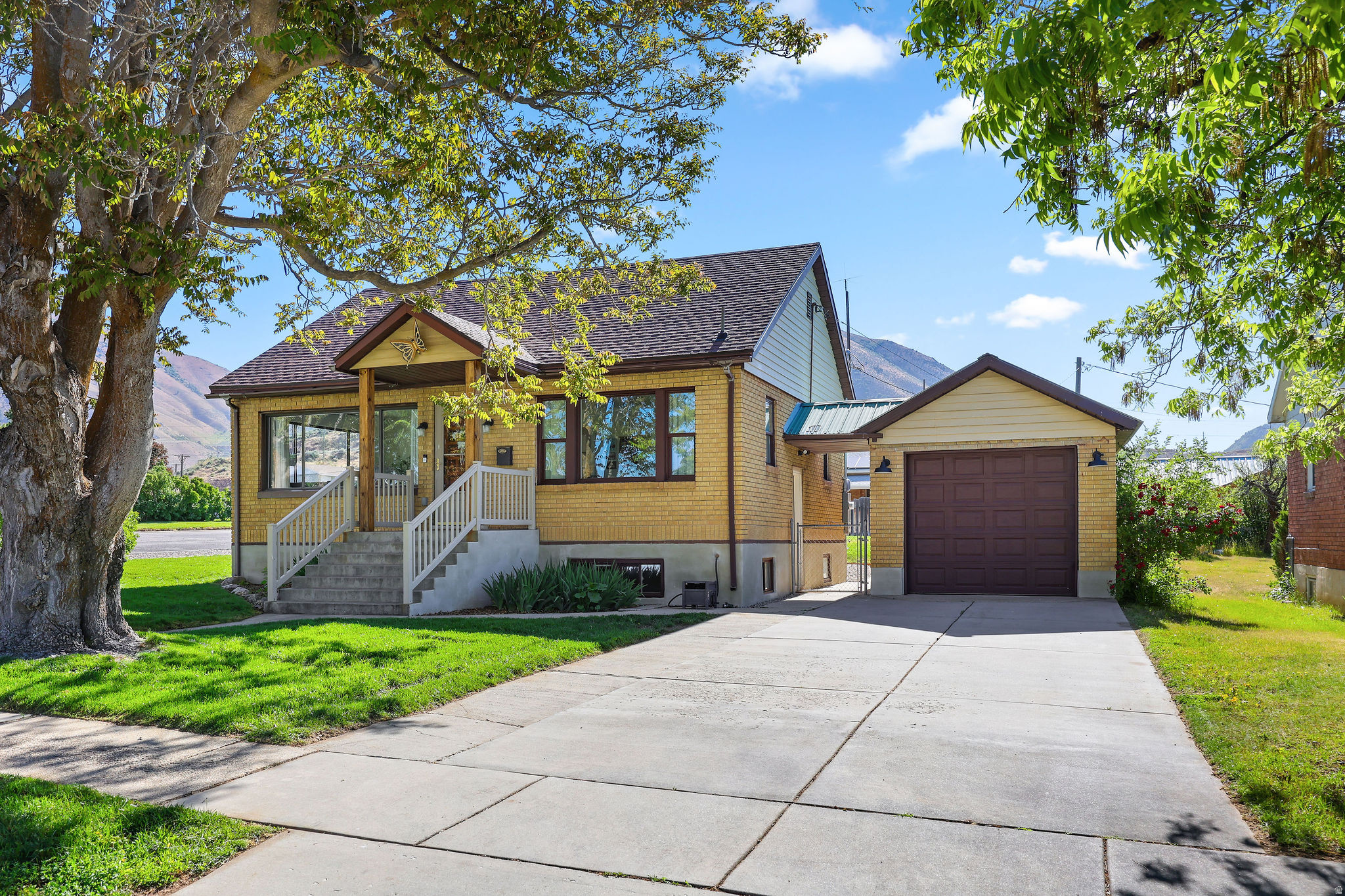 Classic brick charm meets modern flexibility in this beautifully renovated Brigham City rambler with a full basement ADU and private entrance. Enjoy updated kitchens, flooring, plumbing, electrical, lighting, and laundry on both levels. Detached garage, epoxy floors, smart opener, mature trees, mountain views, and extra/RV parking. Don't wait - this one won't last long!